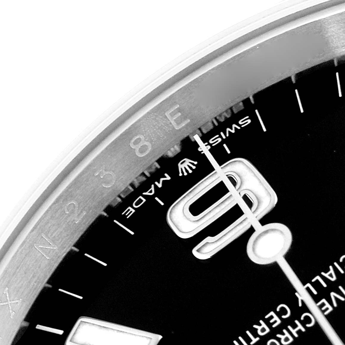 This image shows a close-up of the dial and part of the bezel of a Rolex Explorer 124270 Men's Stainless Steel Black Dial 124270 Men's Stainless Steel Black Dial watch, highlighting the "Swiss Made" inscription and the numeral 6.