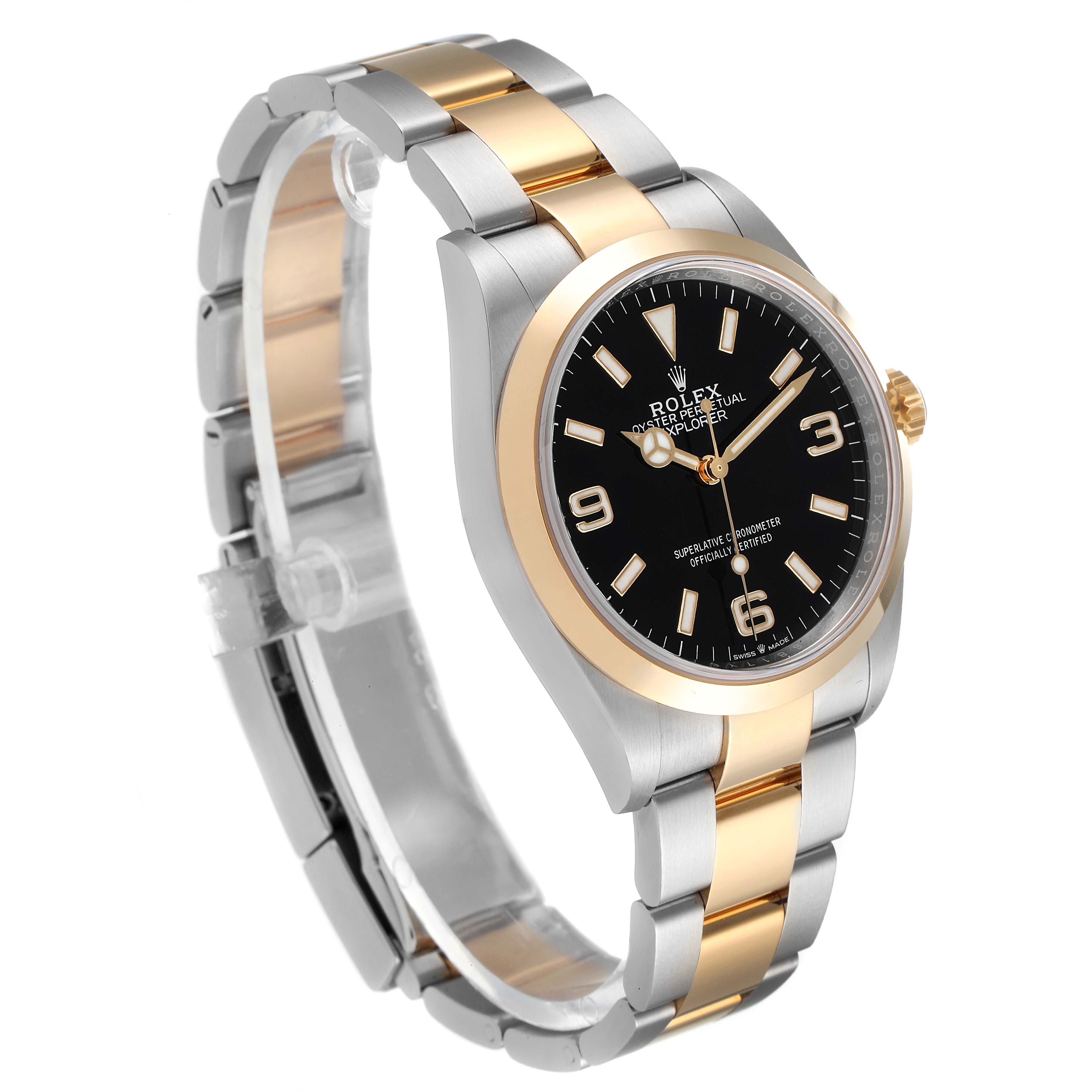 The image shows a side-angle view of the Rolex Explorer 124273 Men's Steel and Gold (two tone) Black Dial 124273 Men's Steel and Gold (two tone) Black Dial watch, highlighting its black dial, two-tone bezel, and bracelet.