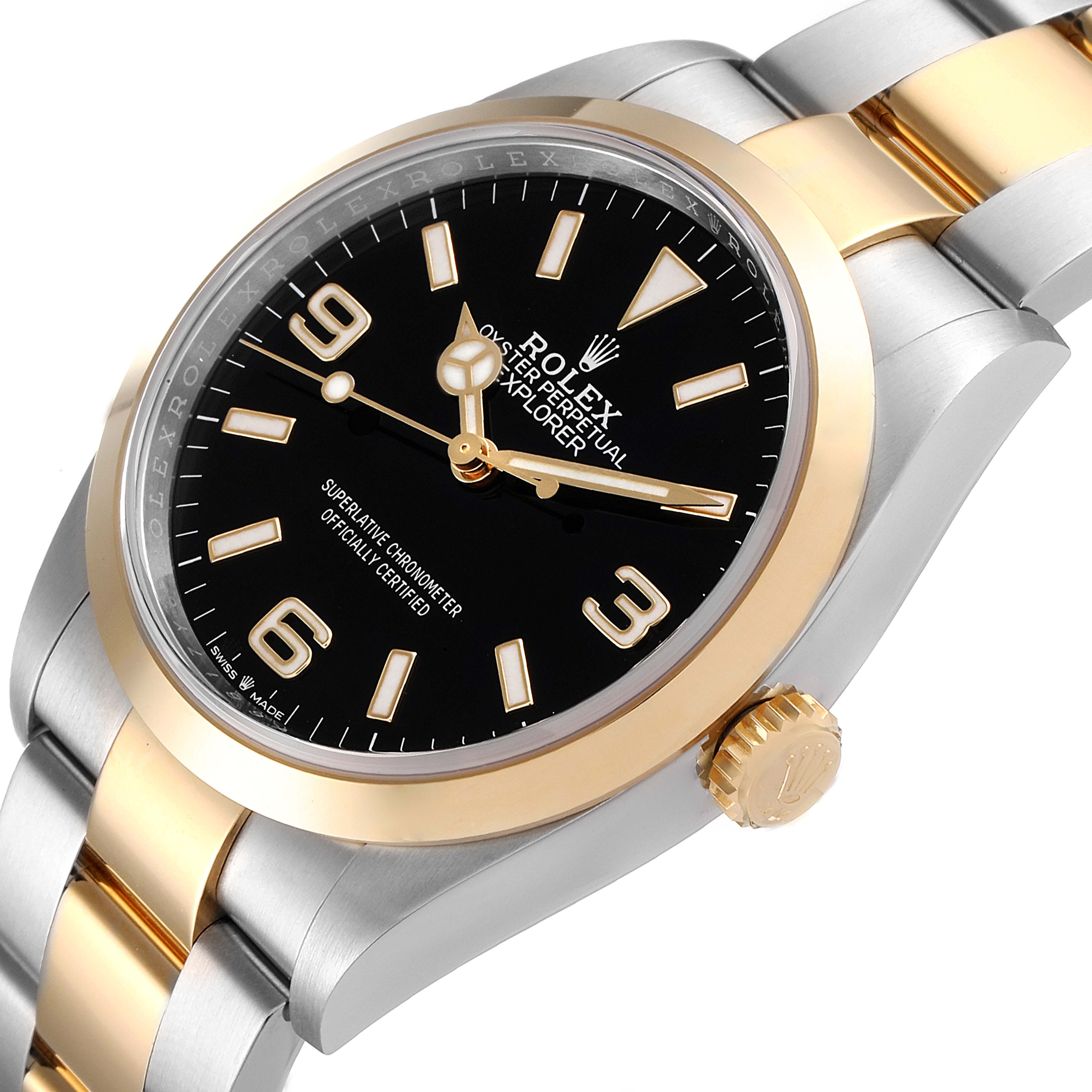 The image shows a close-up angled view of the Rolex Explorer 124273 Men's Steel and Gold (two tone) Black Dial 124273 Men's Steel and Gold (two tone) Black Dial watch, showing its black dial, gold bezel, and two-tone bracelet.