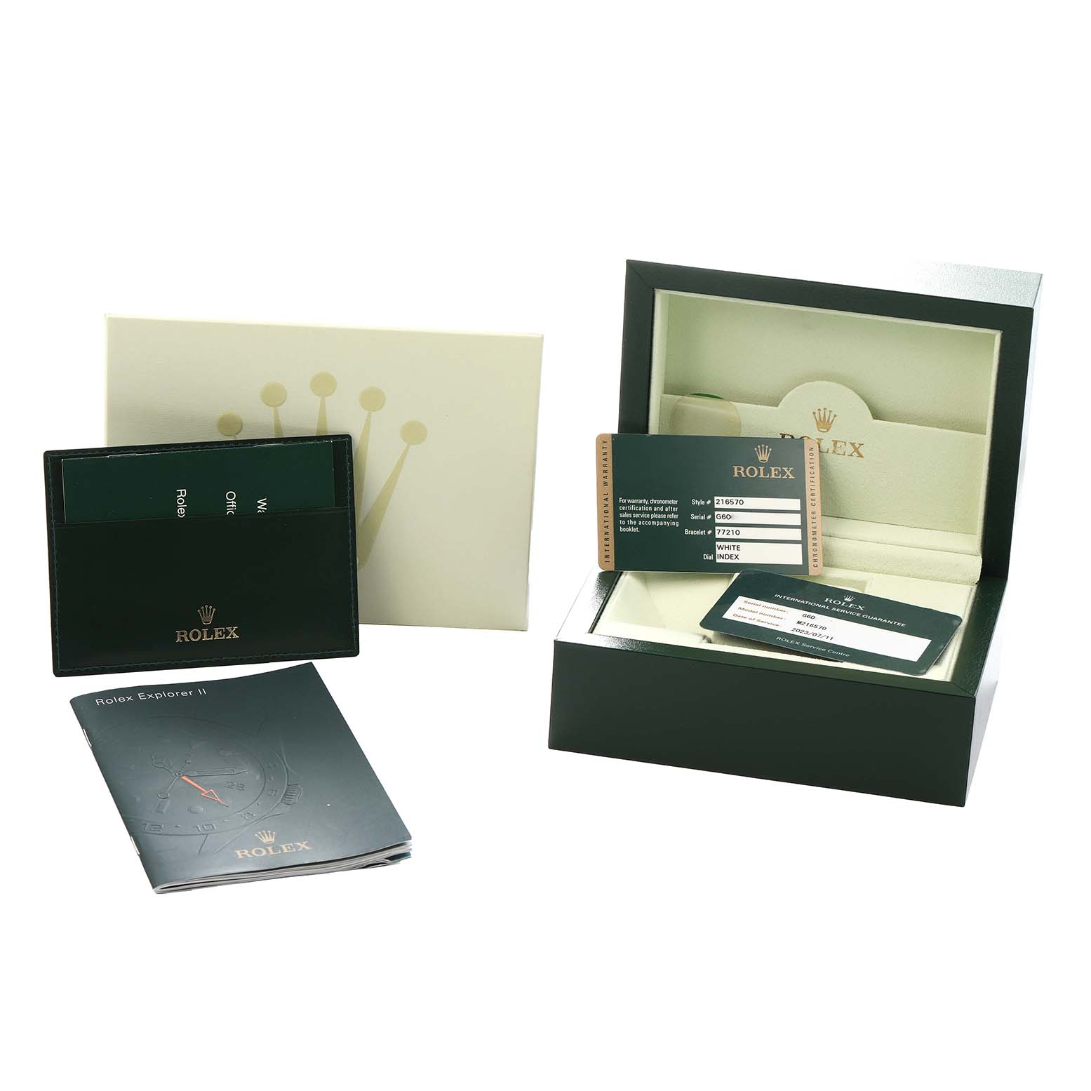 The image shows Rolex Explorer 216570 Men
s Stainless Steel White Dial II accessories, including a box, papers, cardholder, and manual from a front angle.