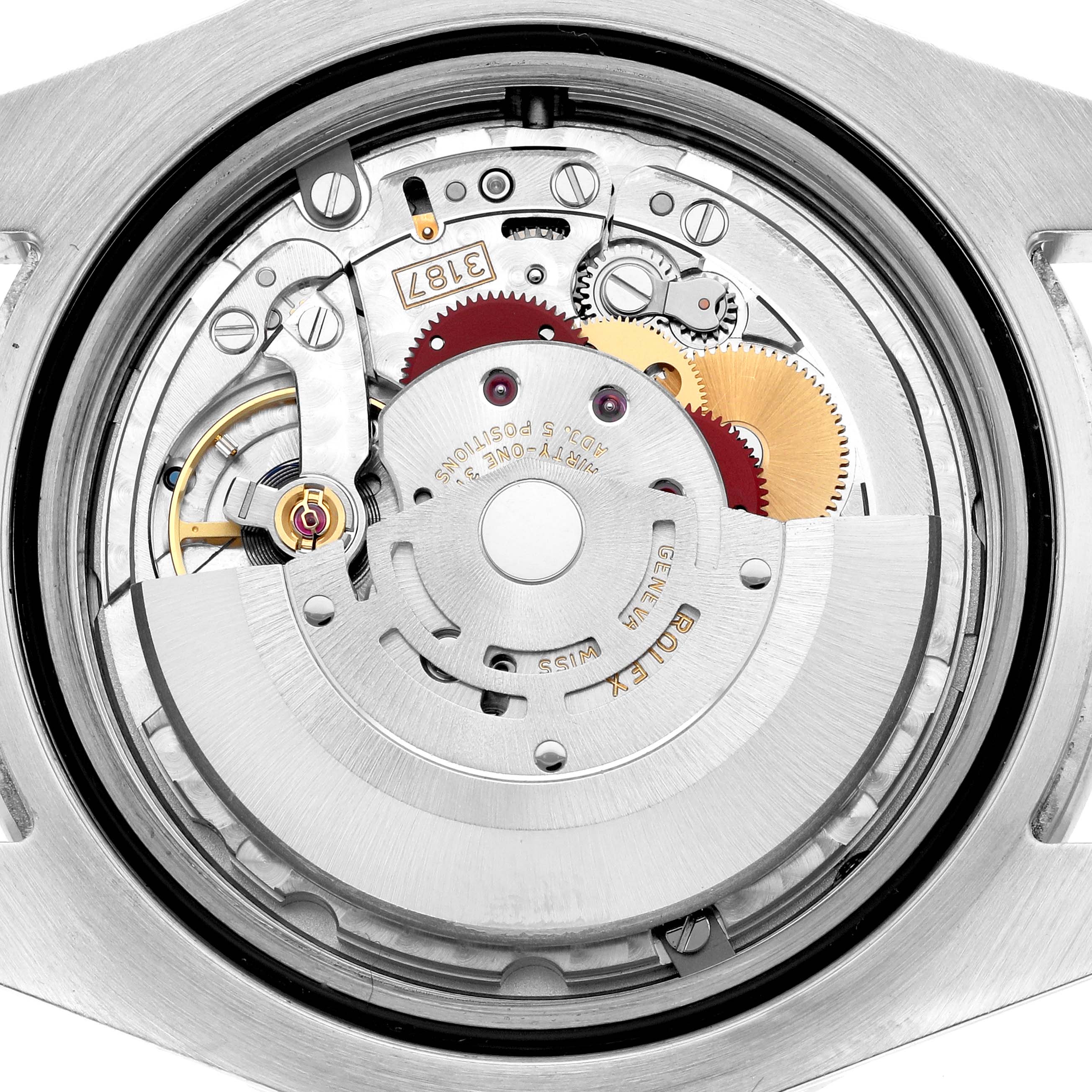 The image shows the inner mechanical movement of a Rolex Explorer 216570 Men
s Stainless Steel White Dial watch, viewed from the back.