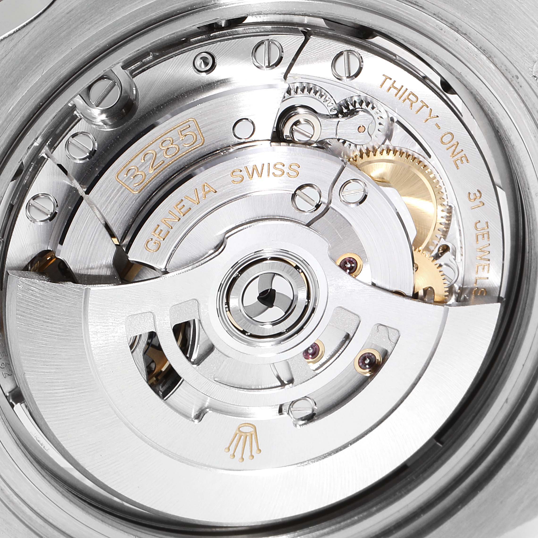 The image shows the open case back angle, revealing the intricate movement mechanism of the Rolex GMT-Master 126711 Men's Steel and Gold (two tone) Black Dial 126711 Men's Steel and Gold (two tone) Black Dial.