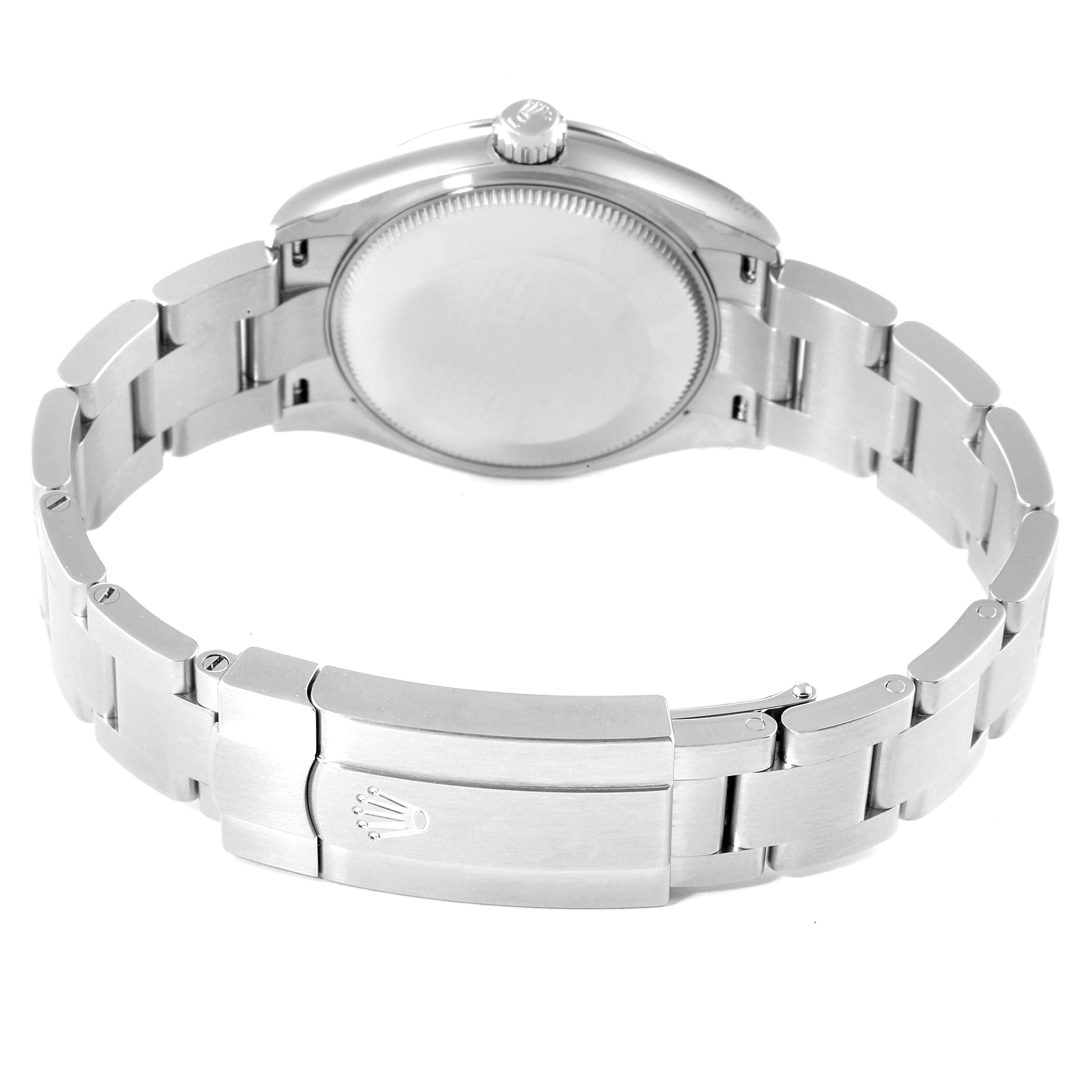 This image shows the back view of a Mid-Size Rolex watch, highlighting the bracelet, clasp with logo, and case back.