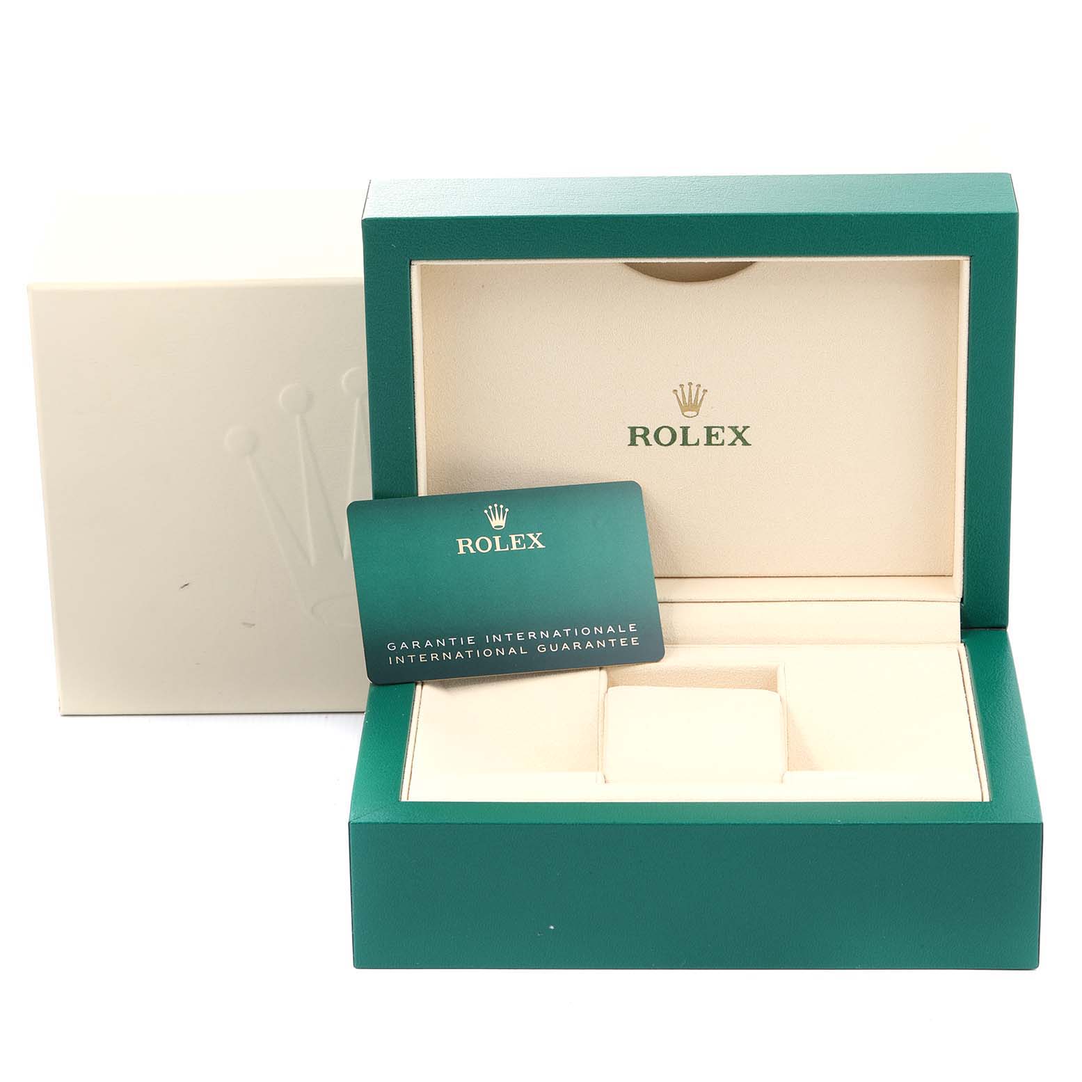 The image shows the packaging and warranty card for a Mid-Size Rolex watch, including a green and cream watch box and an international guarantee card.