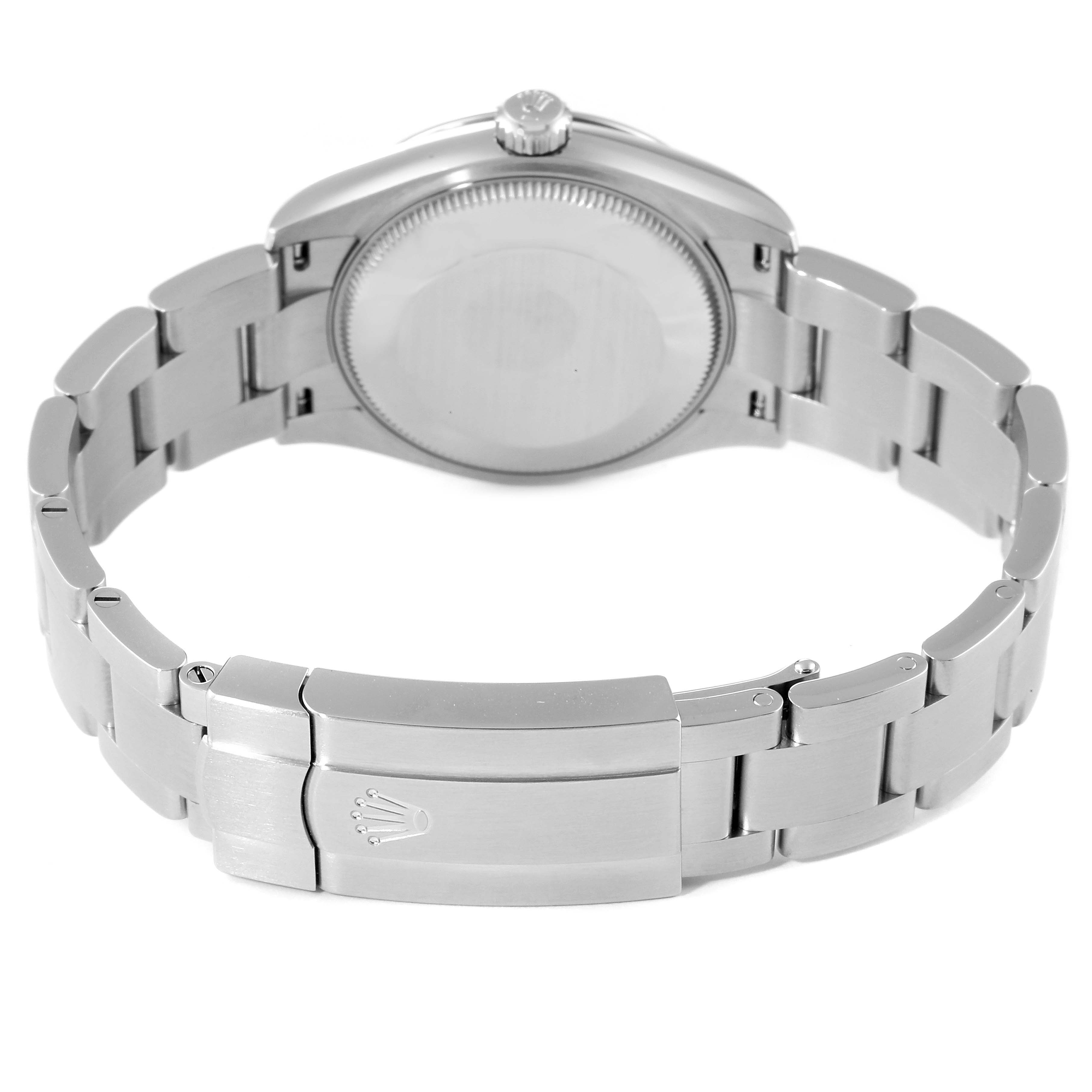 This image shows the back case, crown, and bracelet clasp of a Mid-Size Rolex watch from a rear angle.