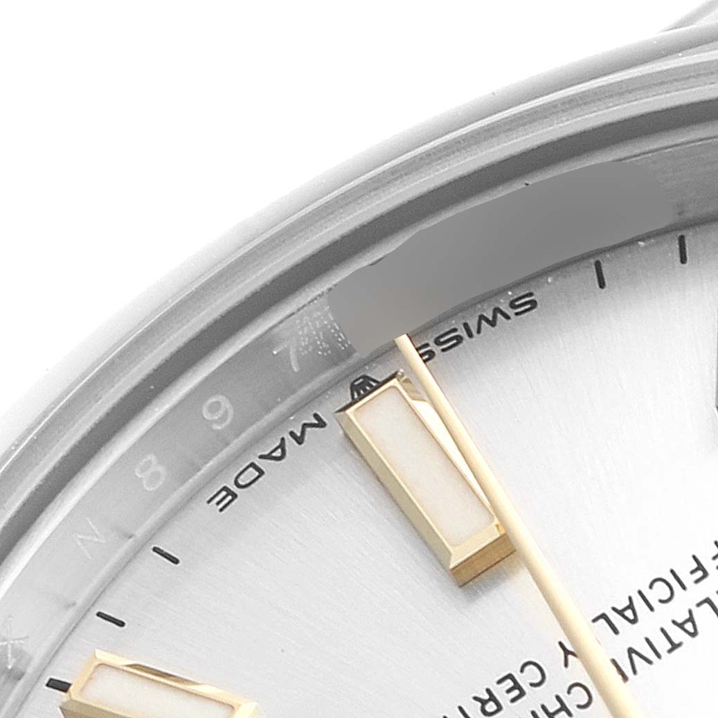 The image shows a close-up view of the dial and markers of a mid-size Rolex watch.