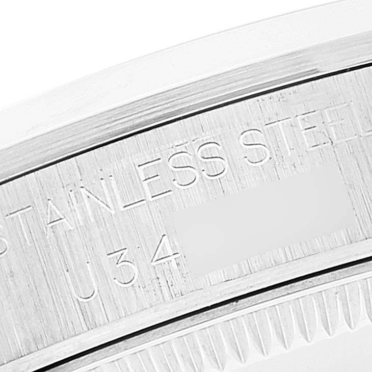 This image shows a close-up of the case side engraving on a Rolex Mid-Size 68240 Women
s Stainless Steel Black Dial 68240 Women
s Stainless Steel Black Dial model watch, featuring "Stainless Steel" text.