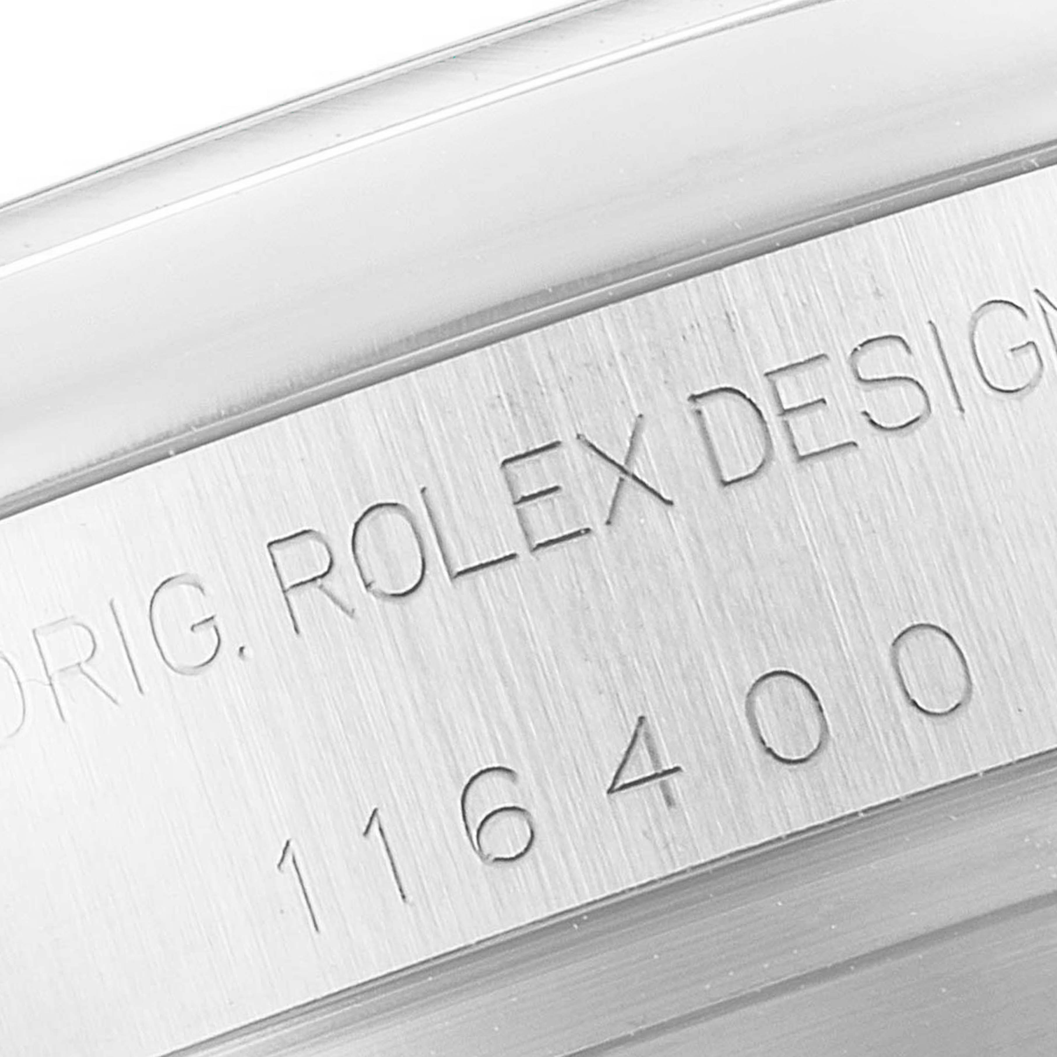 The image shows the engraved side of the case of a Rolex Milgauss 116400 Men's Stainless Steel White Dial 116400 Men's Stainless Steel White Dial watch, including the model number "116400."