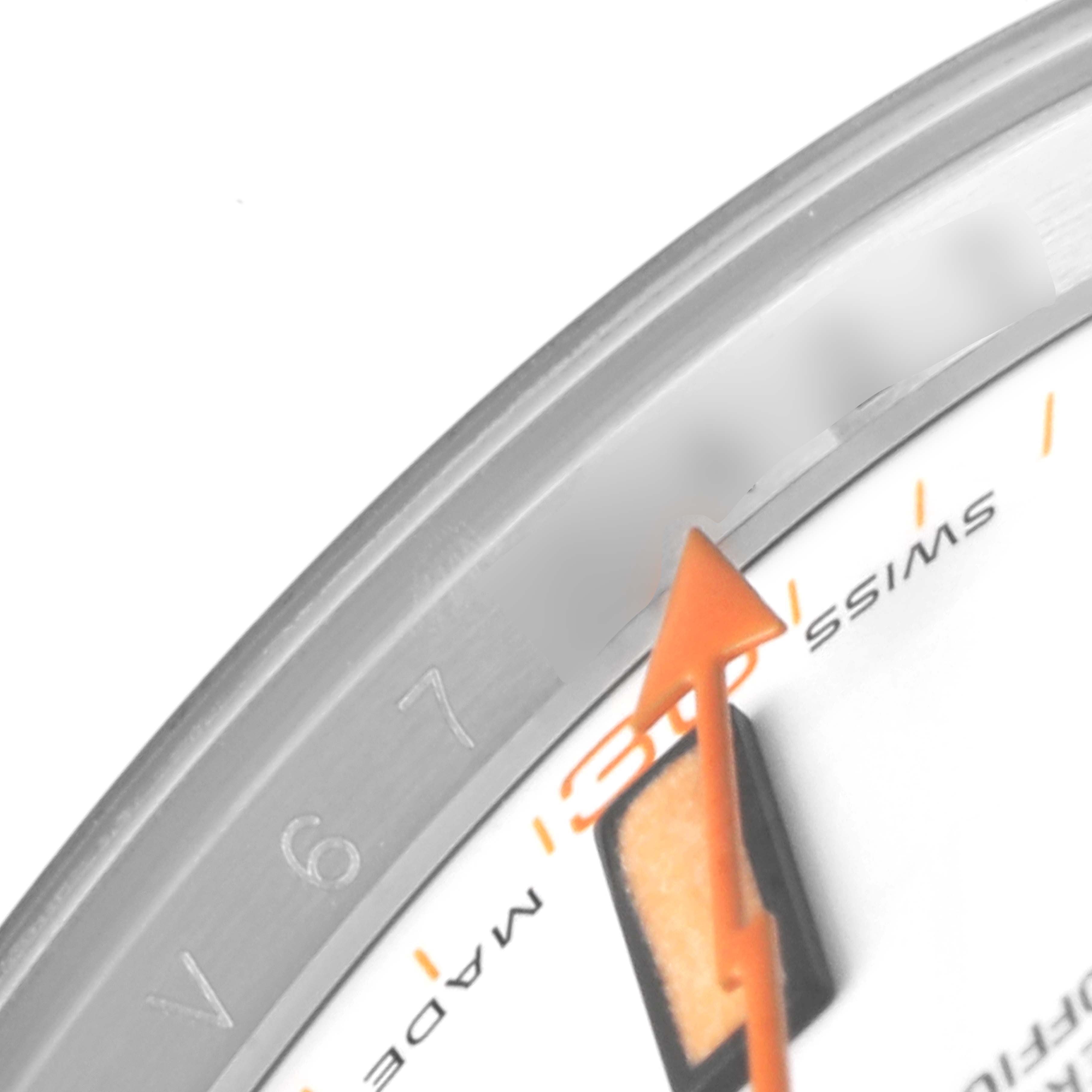 The image shows a close-up of the Rolex Milgauss 116400 Men's Stainless Steel White Dial 116400 Men's Stainless Steel White Dial model watch dial, featuring the orange seconds hand, part of the bezel, and the "SWISS MADE" text.