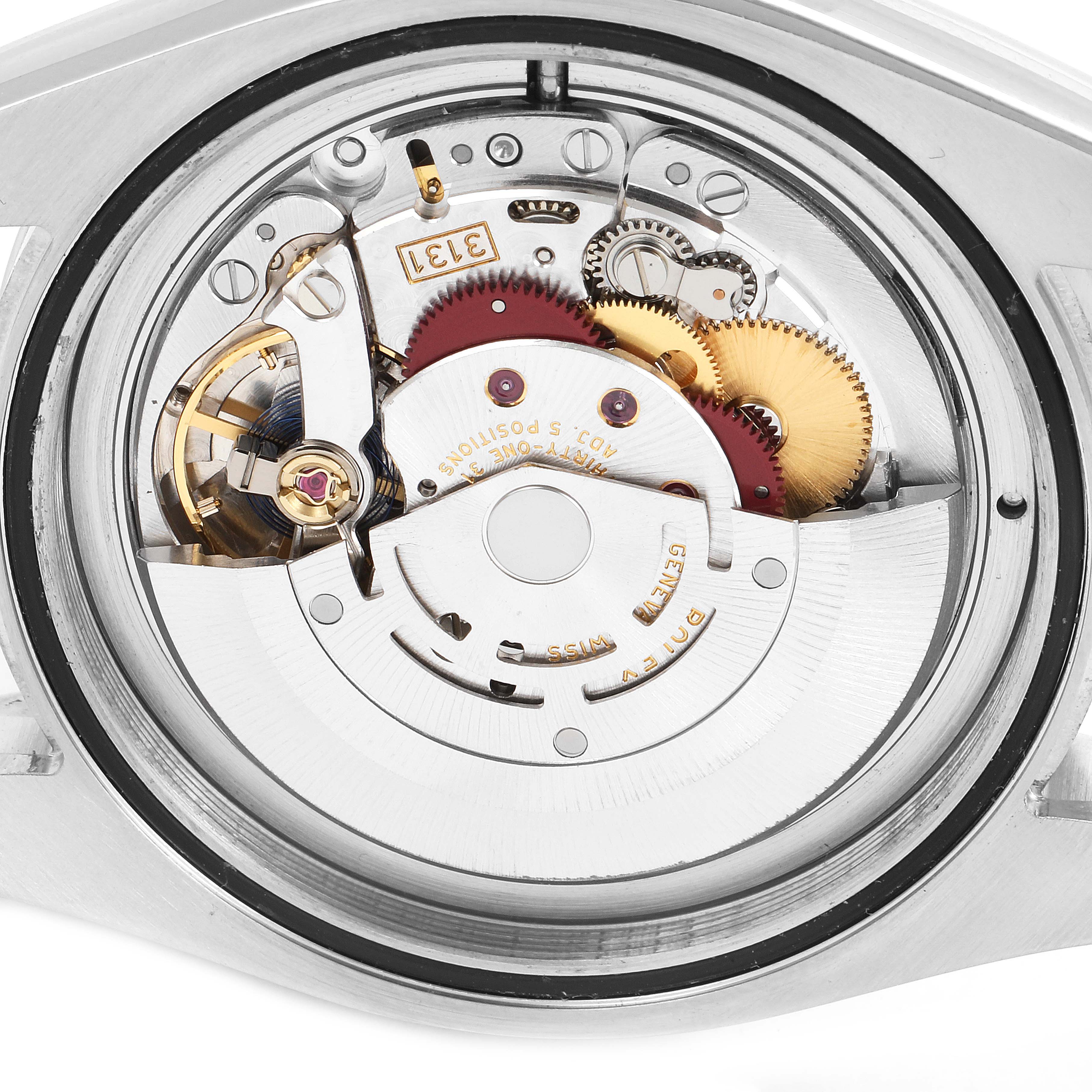 This image displays the movement part of a Rolex Milgauss 116400 Men's Stainless Steel White Dial 116400 Men's Stainless Steel White Dial watch from a back angle, showcasing its intricate internal mechanics.