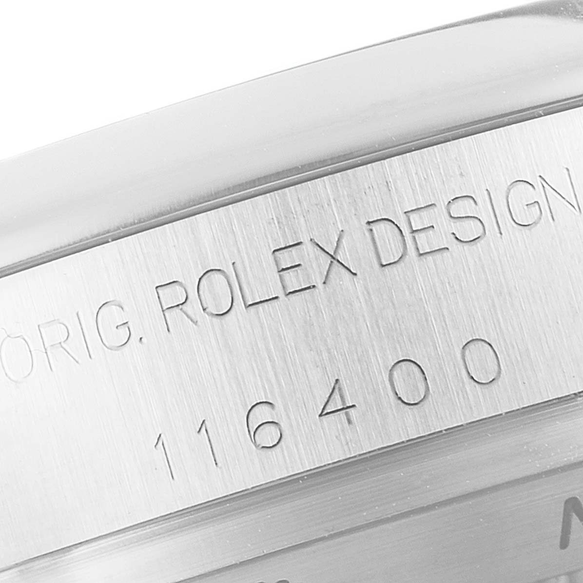 The image shows a close-up of the model number "116400" engraved on the side of the Rolex Milgauss 116400 Men's Stainless Steel White Dial 116400 Men's Stainless Steel White Dial watch case.