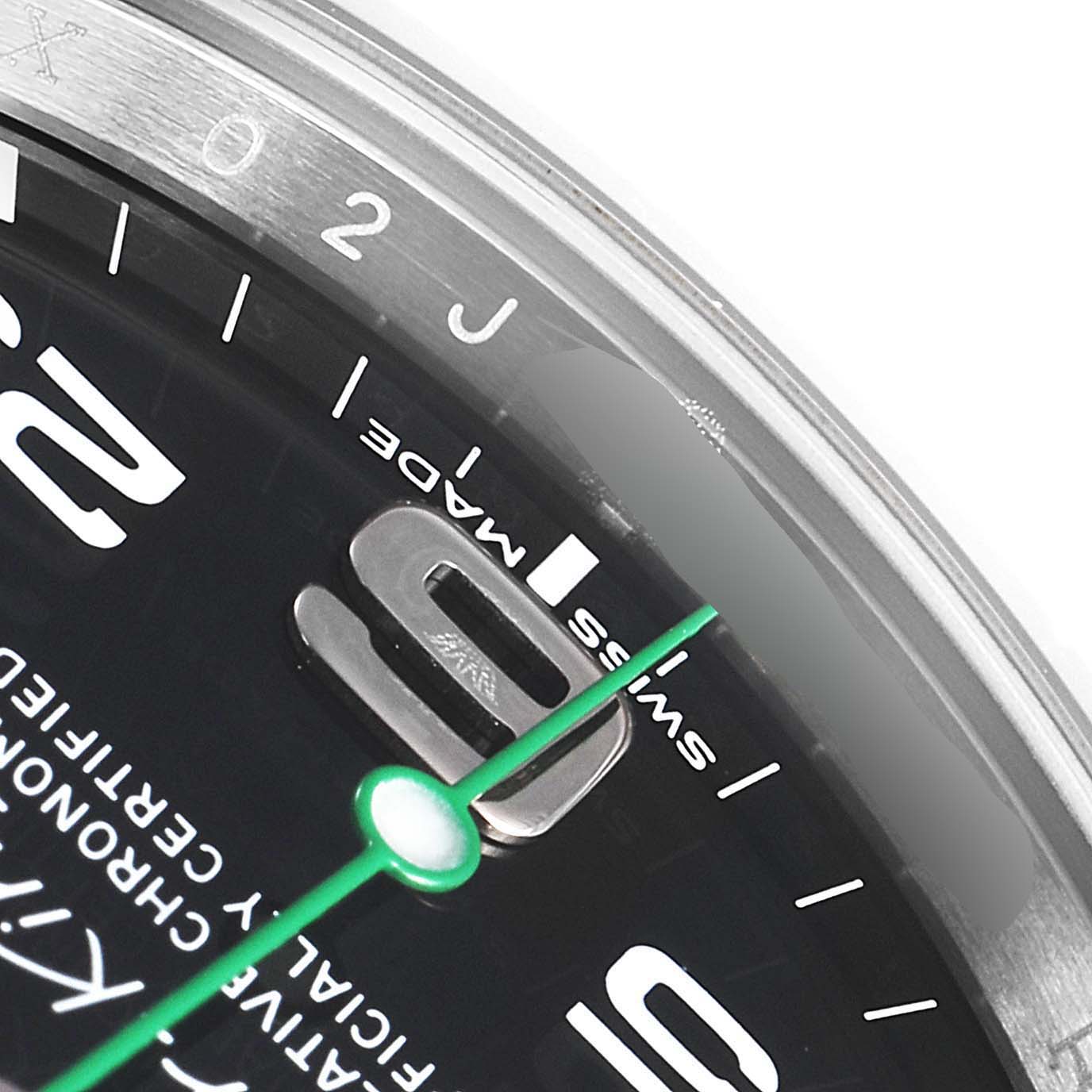 The image shows a close-up view of the dial and bezel of a Rolex Air-King 116900 Men's Stainless Steel Black Dial 116900 Men's Stainless Steel Black Dial, highlighting the "Swiss Made" text and part of the minute markers.