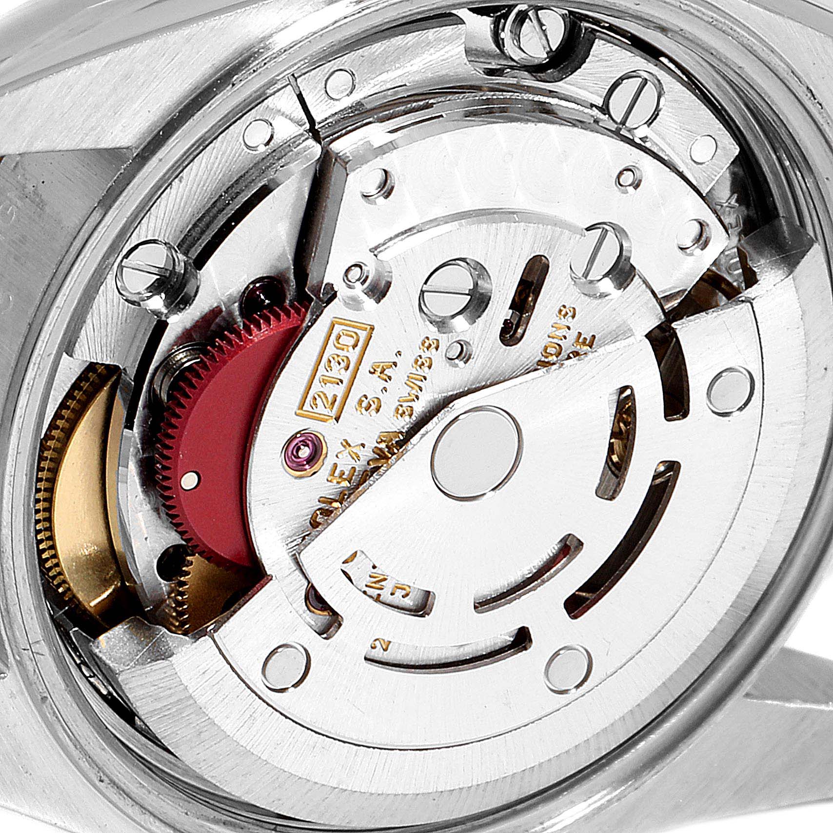This image shows a close-up view of the movement mechanism of a Rolex Oyster Perpetual 67193 Women's Steel and Gold (two tone) Silver Dial 67193 Women's Steel and Gold (two tone) Silver Dial watch.