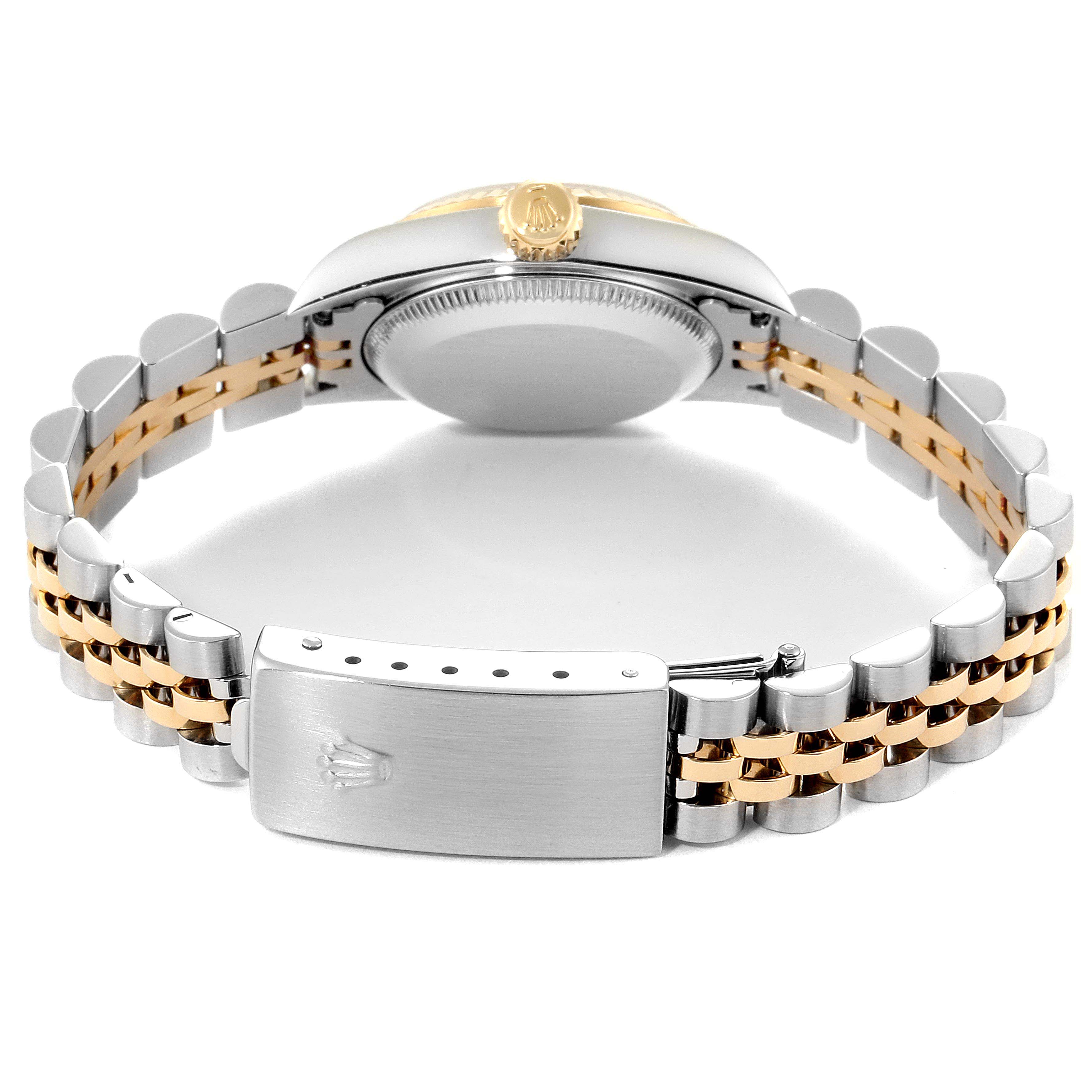 This image shows the back view of a Rolex Oyster Perpetual 67193 Women's Steel and Gold (two tone) Silver Dial 67193 Women's Steel and Gold (two tone) Silver Dial watch, highlighting the clasp, bracelet, and part of the case.