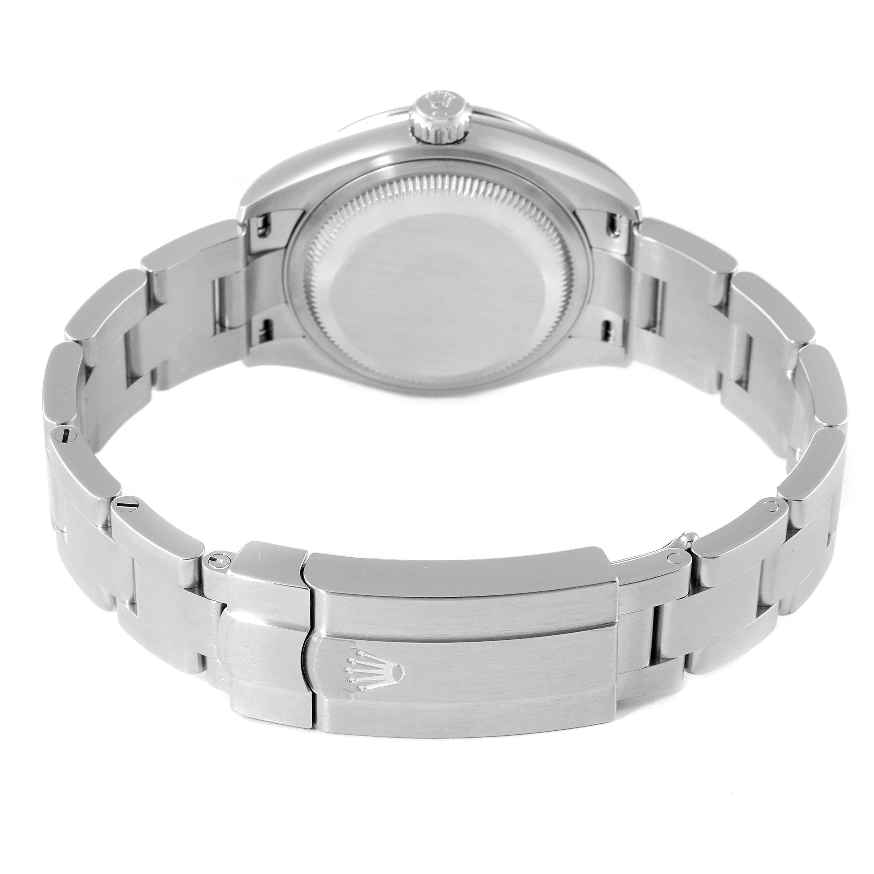 The image shows the back view and clasp of a Rolex Oyster Perpetual 276200 Women
s Stainless Steel Pink Dial 276200 Women
s Stainless Steel Pink Dial watch, focusing on the stainless steel bracelet and case back.