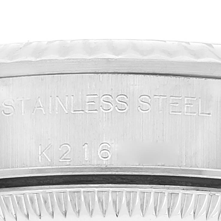 The image shows a close-up of the stainless steel case back engraving on a Rolex Oyster Perpetual 76094 Women's Stainless Steel Black Dial 76094 Women's Stainless Steel Black Dial watch.