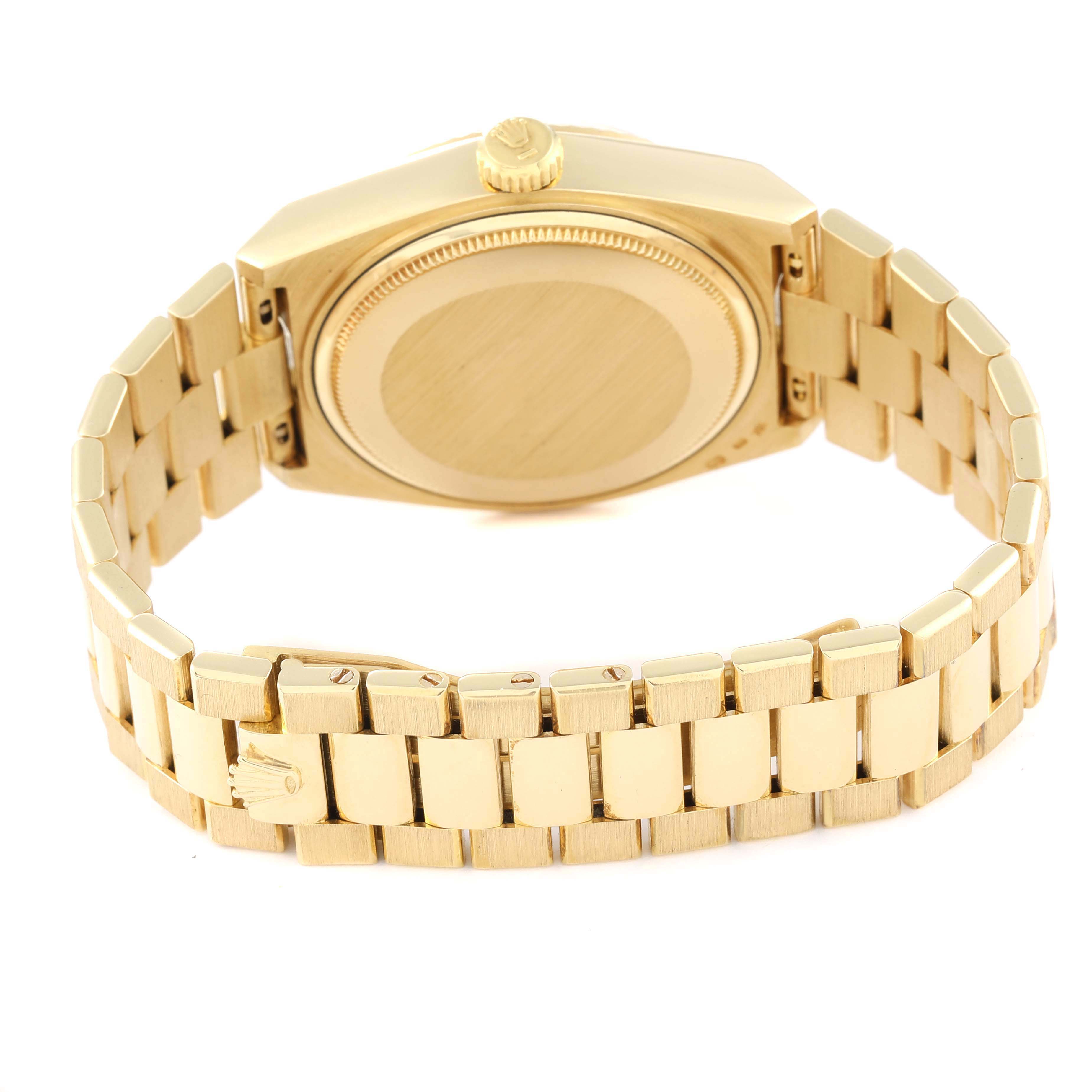 The image shows the back view of a Rolex Oysterquartz 19018 Men
s Yellow Gold Champagne Dial 19018 Men
s Yellow Gold Champagne Dial watch, highlighting its case back and bracelet.