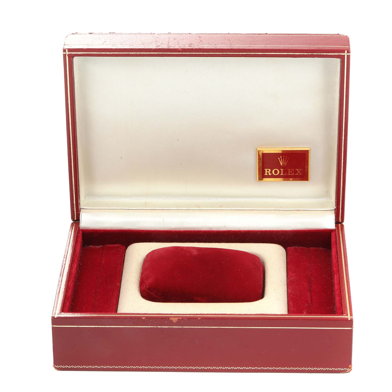 The image shows an open Rolex watch box for the President model, featuring red and beige padding with a logo inside.