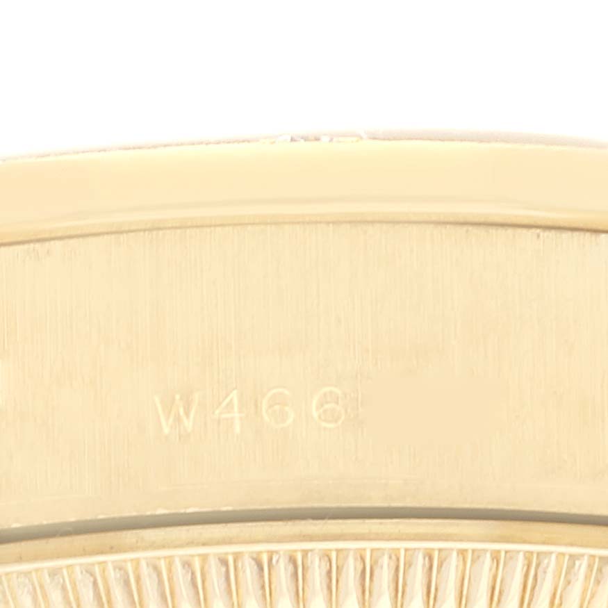 This image shows a close-up angle of the case back of a Rolex President 69288 Women's Yellow Gold Champagne Dial 69288 Women's Yellow Gold Champagne Dial model, highlighting the etched markings.