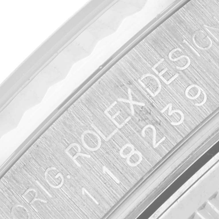 This image shows a close-up of the engraved inner case back of a Rolex President 118239 Men's White Gold Silver Dial 118239 Men's White Gold Silver Dial model watch.
