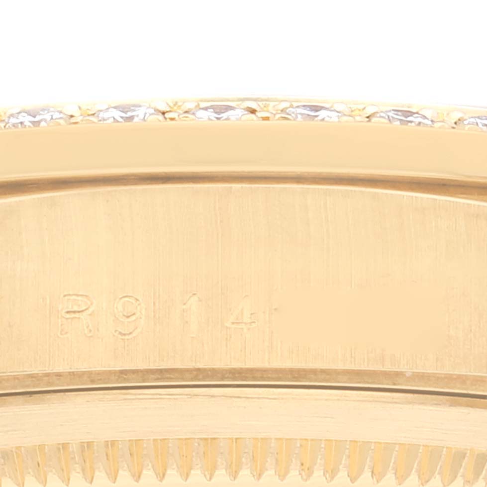 This close-up image shows the side engraving on the bezel of a Rolex President 18348 Men's Yellow Gold Champagne Dial 18348 Men's Yellow Gold Champagne Dial model watch.