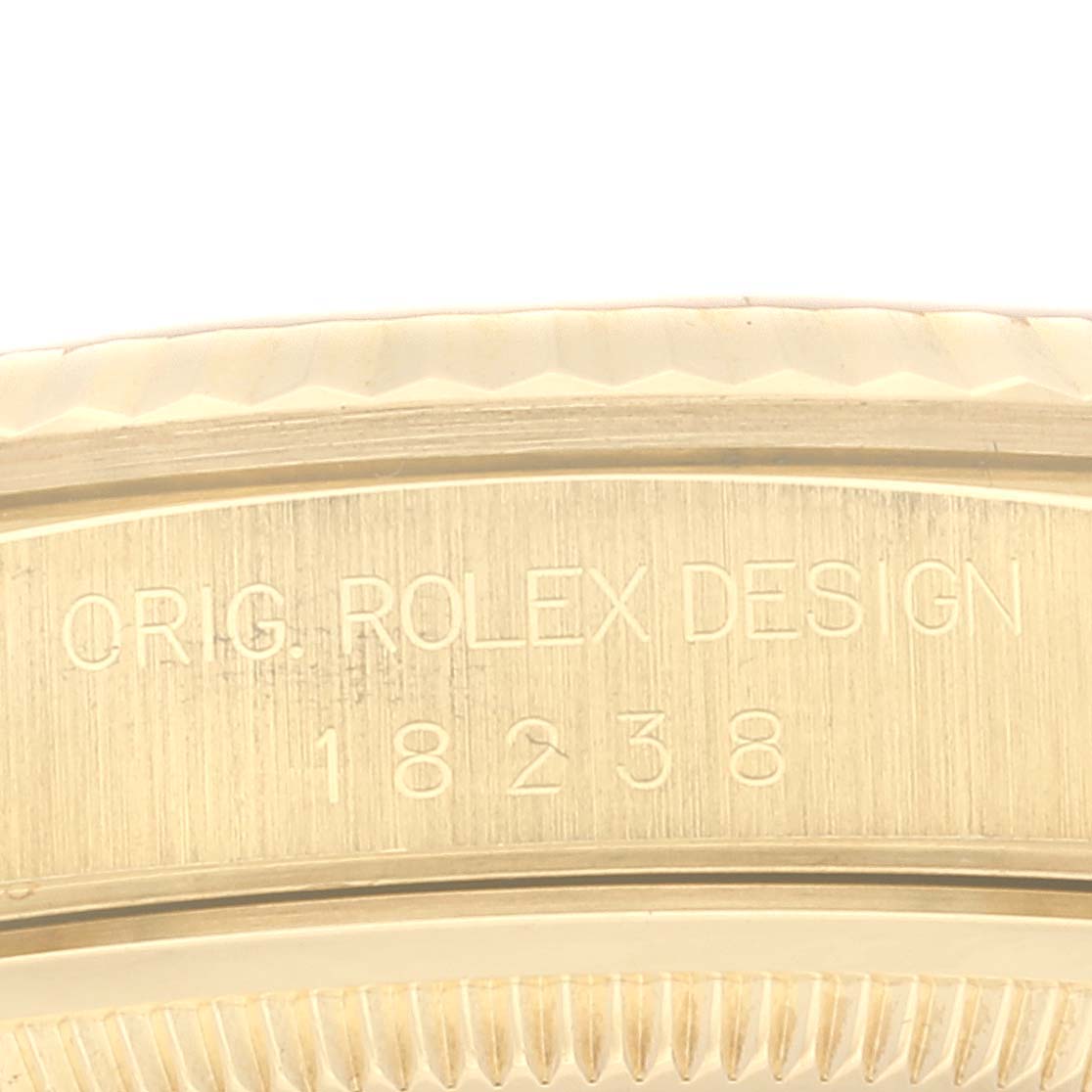 Close-up of the bezel and engraved side of the Rolex President 18238 Men's Yellow Gold Champagne Dial 18238 Men's Yellow Gold Champagne Dial model with the design code 18238 visible.