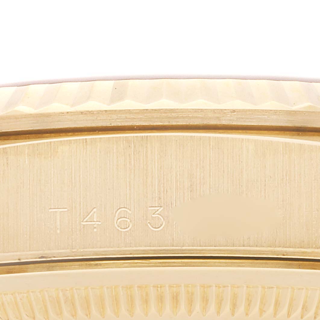 This close-up image shows the side profile of the bezel and case, along with part of the engraving on the Rolex President 18238 Men's Yellow Gold Champagne Dial 18238 Men's Yellow Gold Champagne Dial watch.