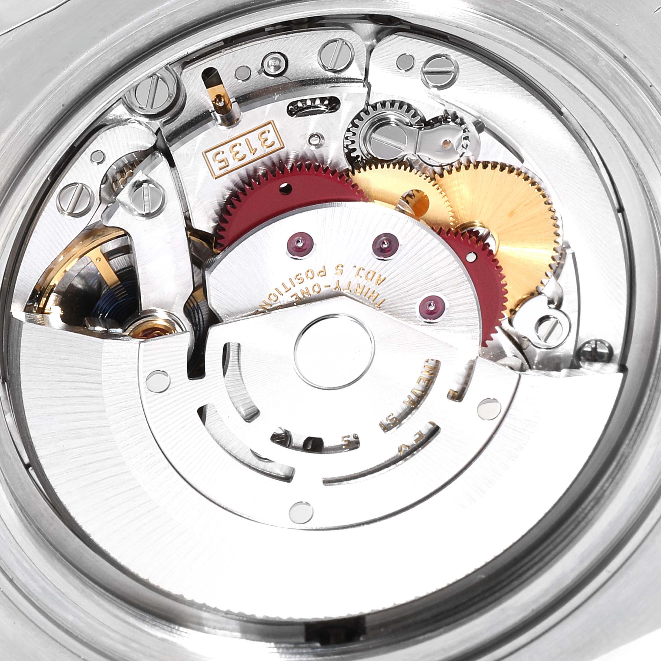 This is a close-up view of the movement mechanism of a Rolex Sea-Dweller 116600 Men
s Stainless Steel Black Dial 116600 Men
s Stainless Steel Black Dial watch, showing gears and components.