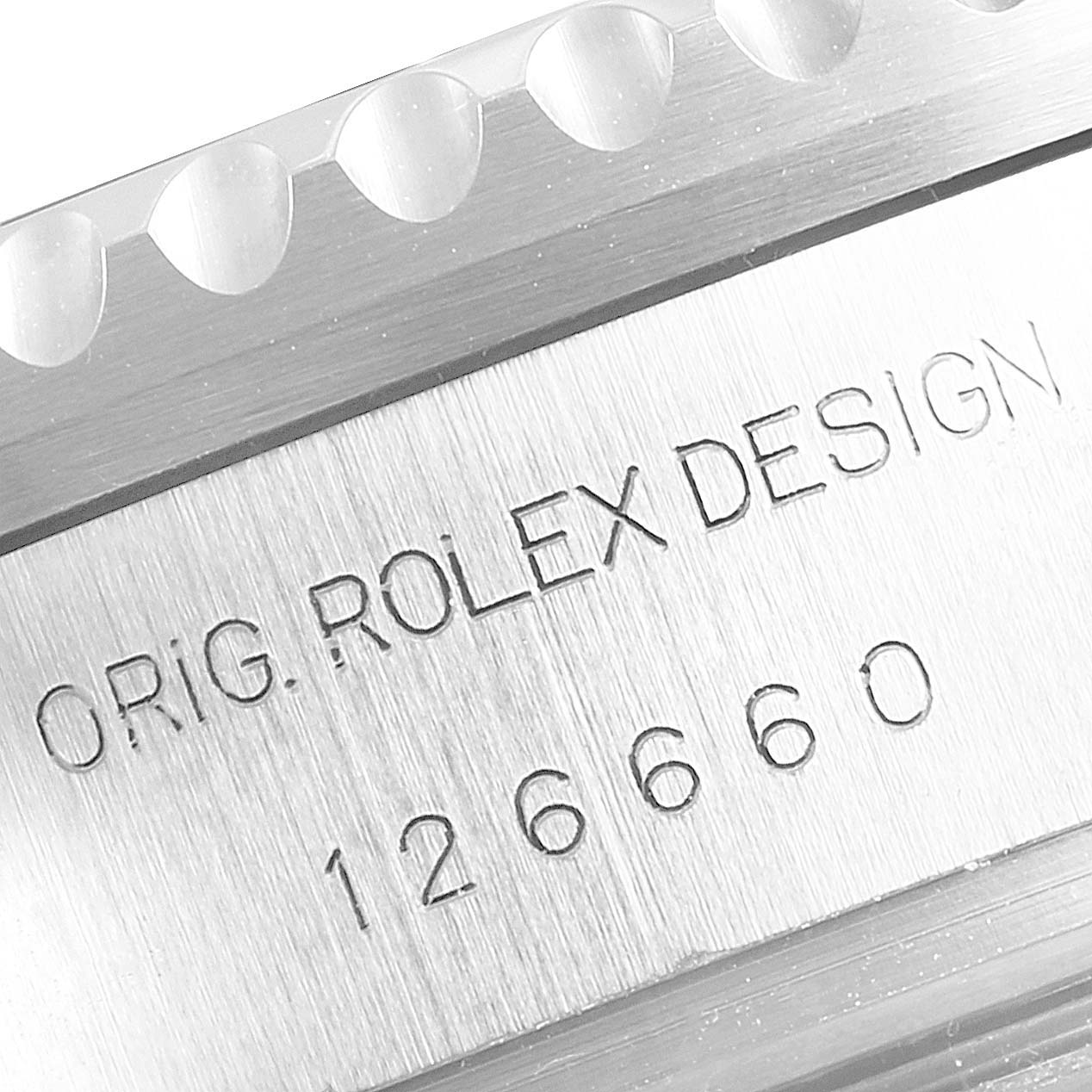 This close-up image shows the bezel and engraved text of the Rolex Sea-Dweller 126660 Men
s Stainless Steel Blue Dial 126660 Men
s Stainless Steel Blue Dial watch.