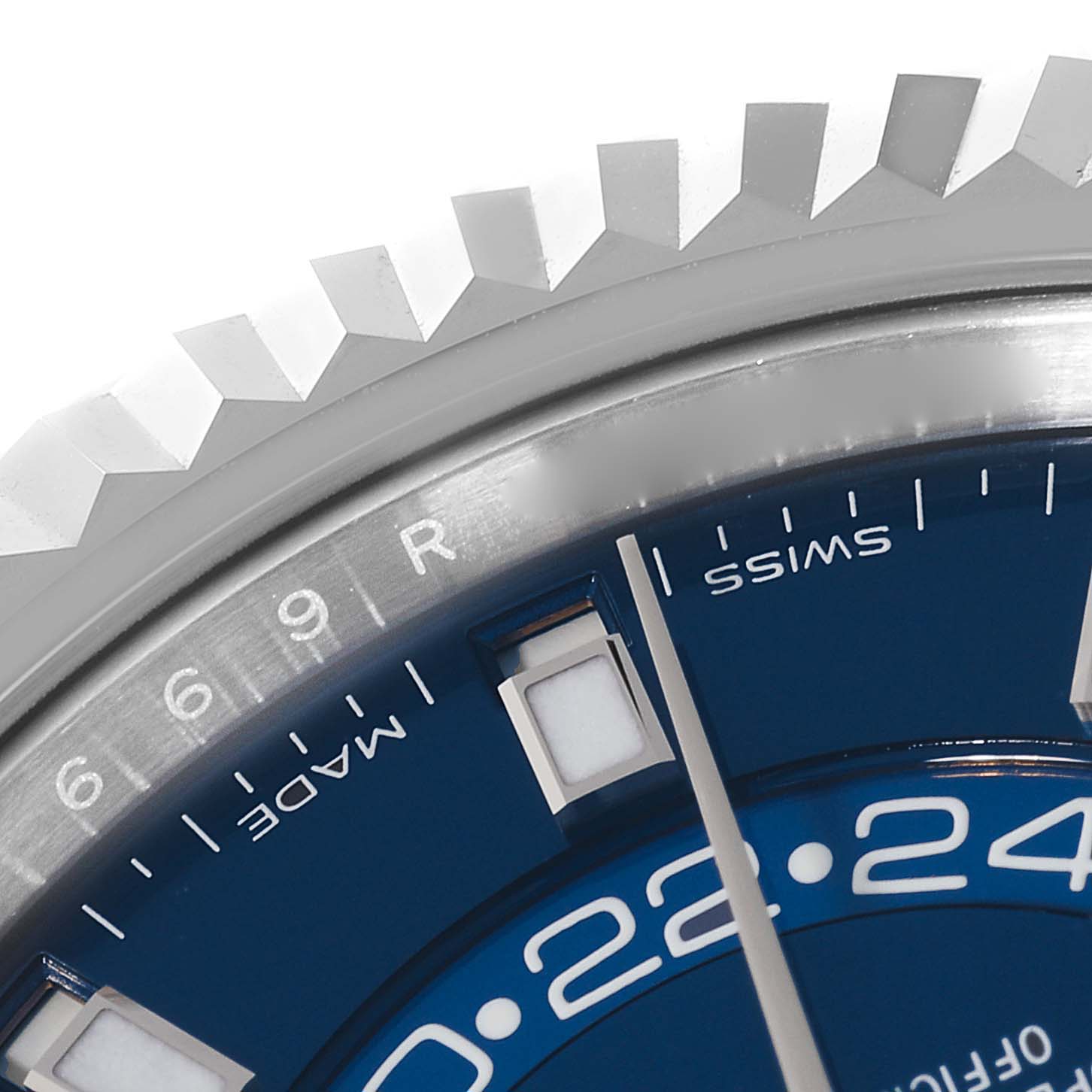 The image shows a close-up of the bezel, part of the blue dial, and hour markers on a Rolex Sky-Dweller 326934 Men's Stainless Steel Blue Dial 326934 Men's Stainless Steel Blue Dial watch.