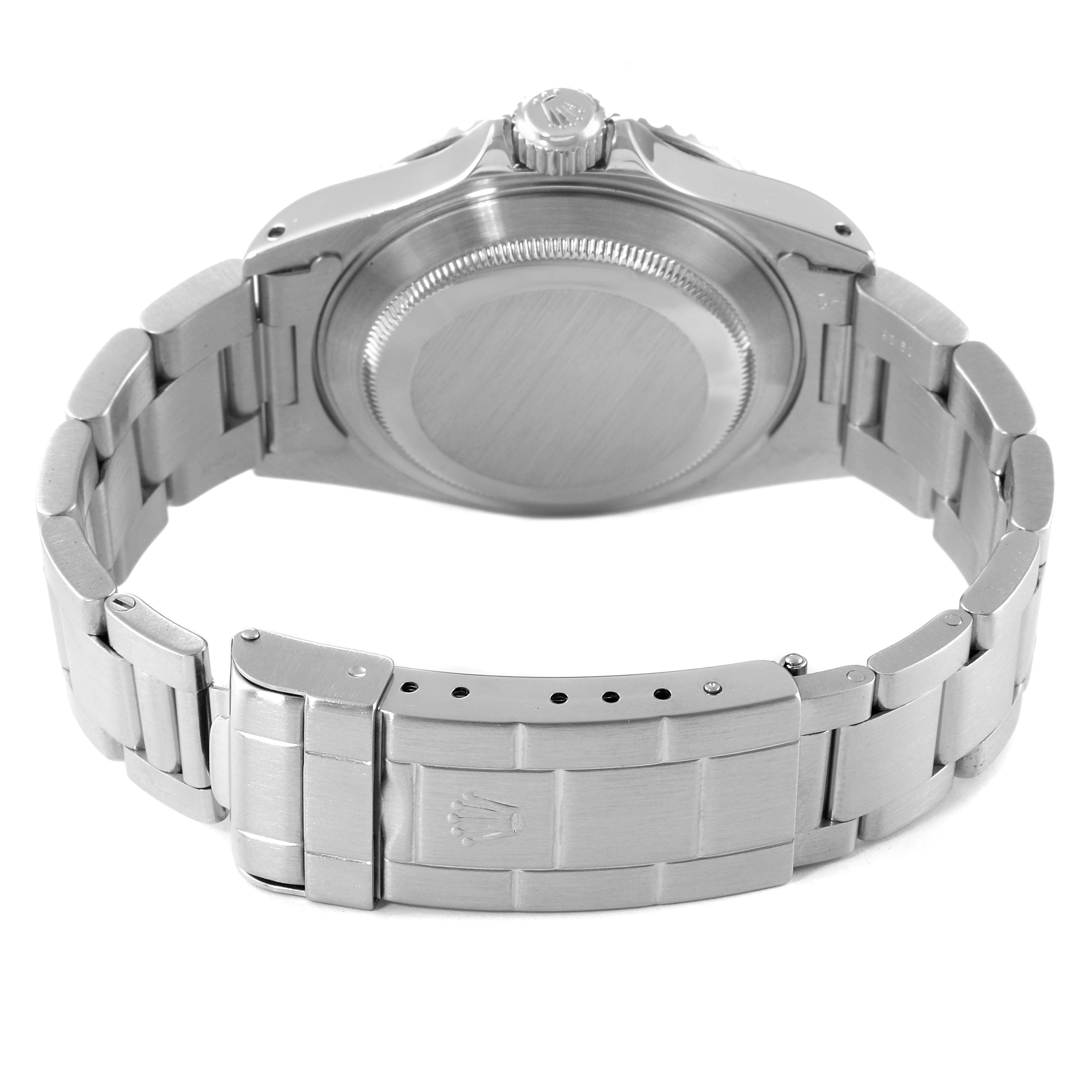 The image shows the back view of a Rolex Submariner 14060 Men
s Stainless Steel Black Dial 14060 Men
s Stainless Steel Black Dial watch, focusing on its case back and metal bracelet with a clasp.