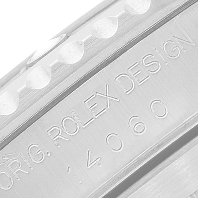 This close-up image shows the engraved case and bezel of a Rolex Submariner 14060 Men
s Stainless Steel Black Dial 14060 Men
s Stainless Steel Black Dial.