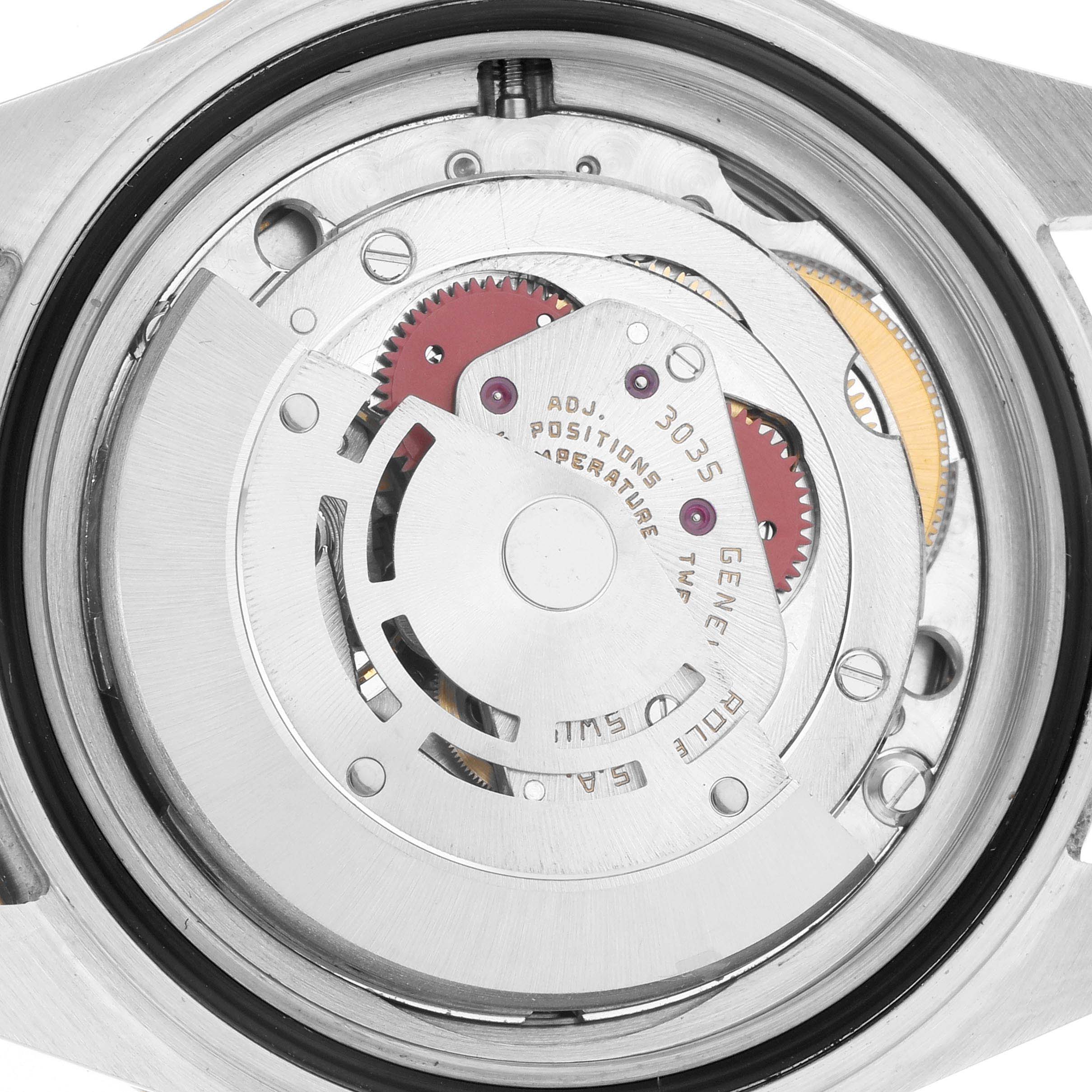 The image shows the internal movement mechanism of a Rolex Submariner 16803 Men
s Steel and Gold (two tone) Black Dial watch from a top-down angle.