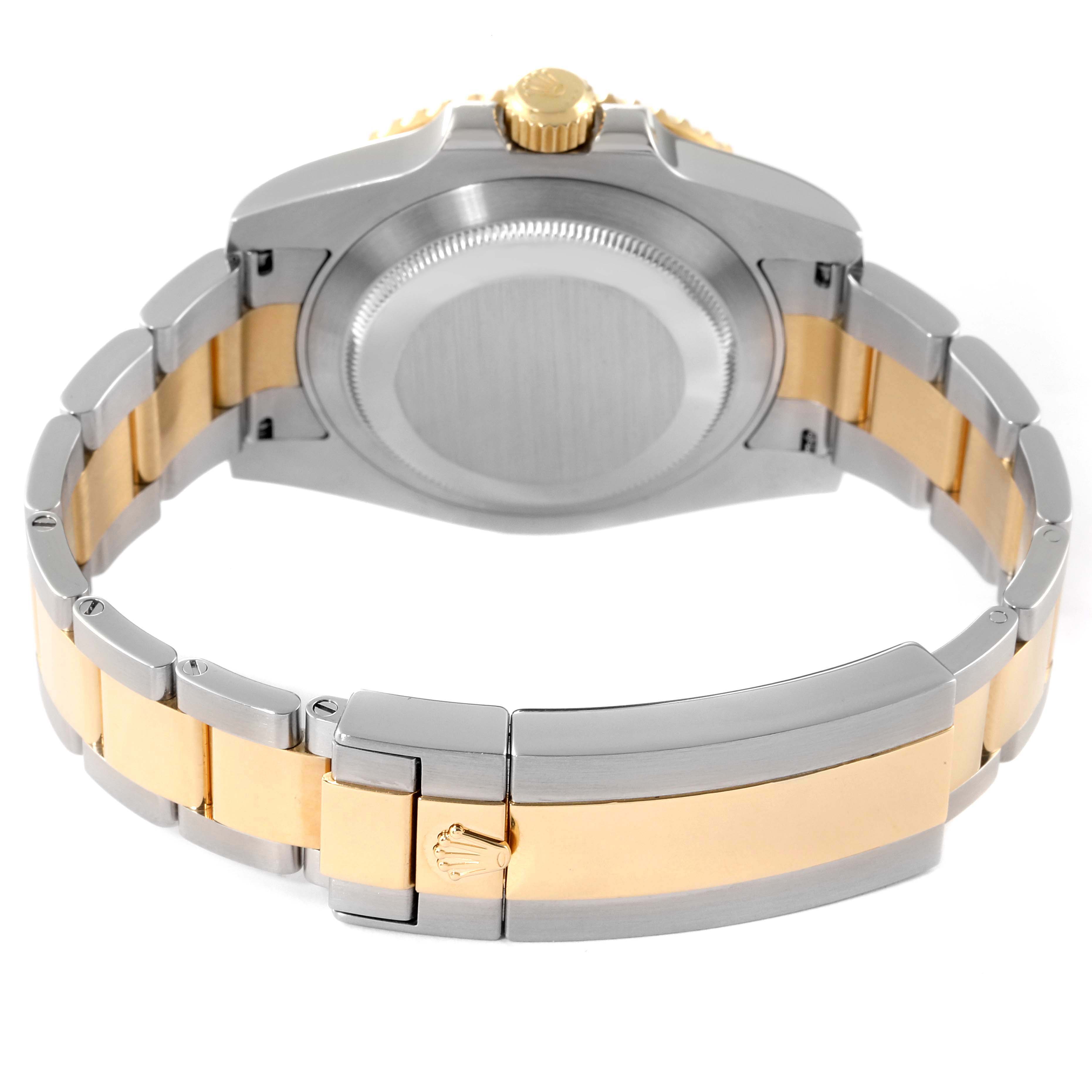 The image shows the back and bracelet of a Rolex Submariner 116613 Men's Steel and Gold (two tone) Blue Dial 116613 Men's Steel and Gold (two tone) Blue Dial watch, highlighting its two-tone gold and silver design.