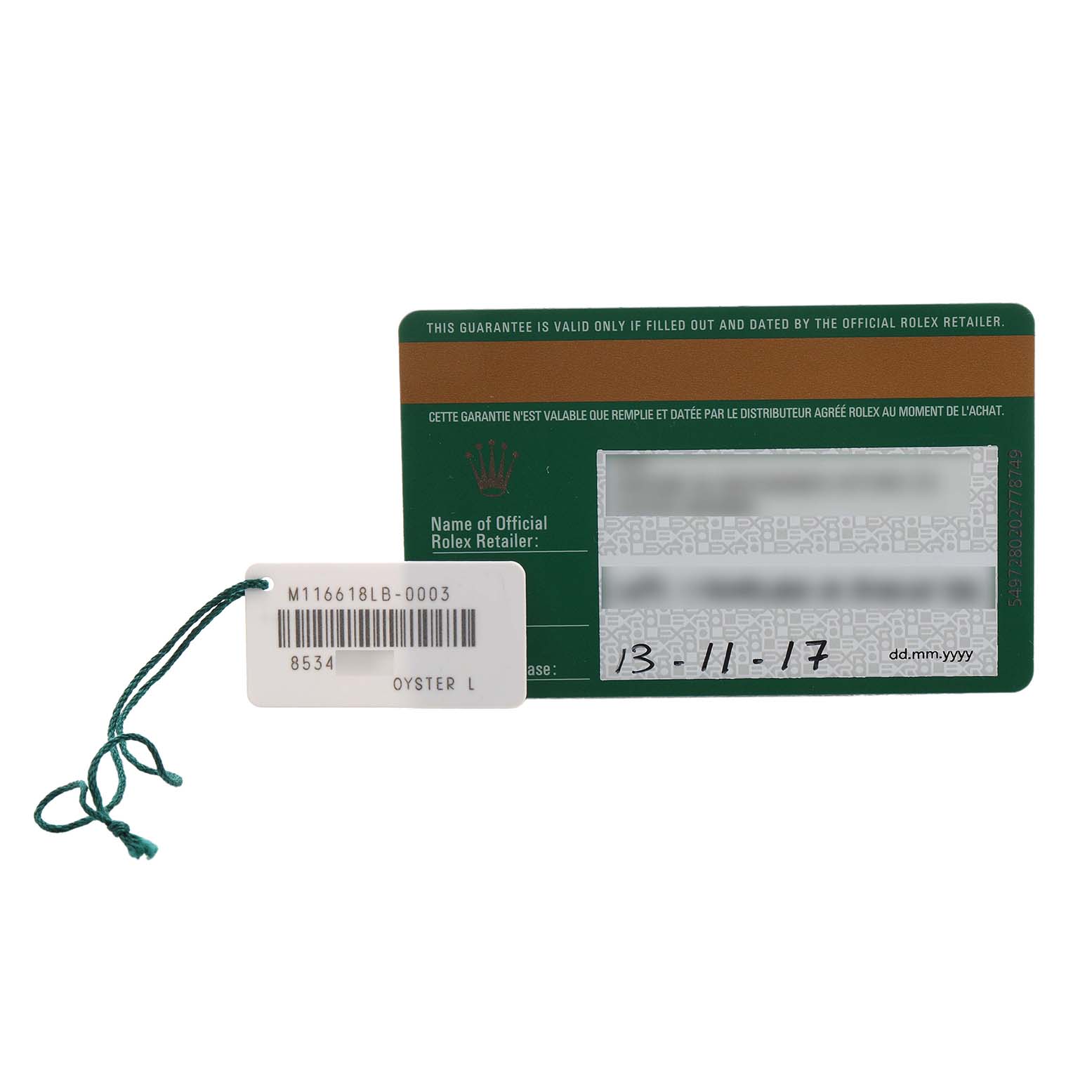 The image shows a Rolex warranty card and a tag for the Submariner model, with reference numbers visible.