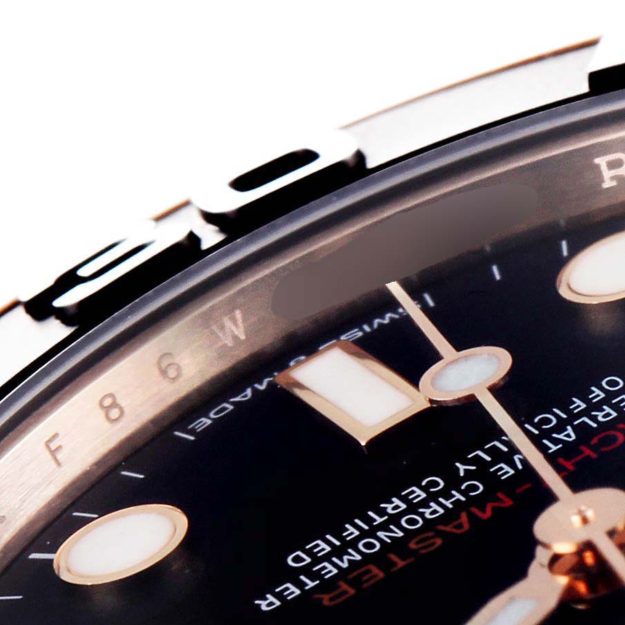 The image shows a close-up of the bezel, dial, and part of the hands of a Rolex Yacht-Master 268655 Men's Rose Gold Black Dial 268655 Men's Rose Gold Black Dial watch at an oblique angle.