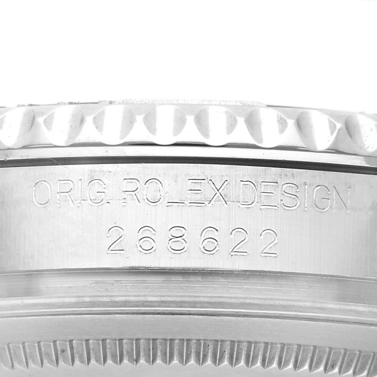 The image showcases the side view of a Rolex Yacht-Master 268622 Men
s Stainless Steel Silver Dial watch, focusing on the engraved model number and the watch
s edge detailing.