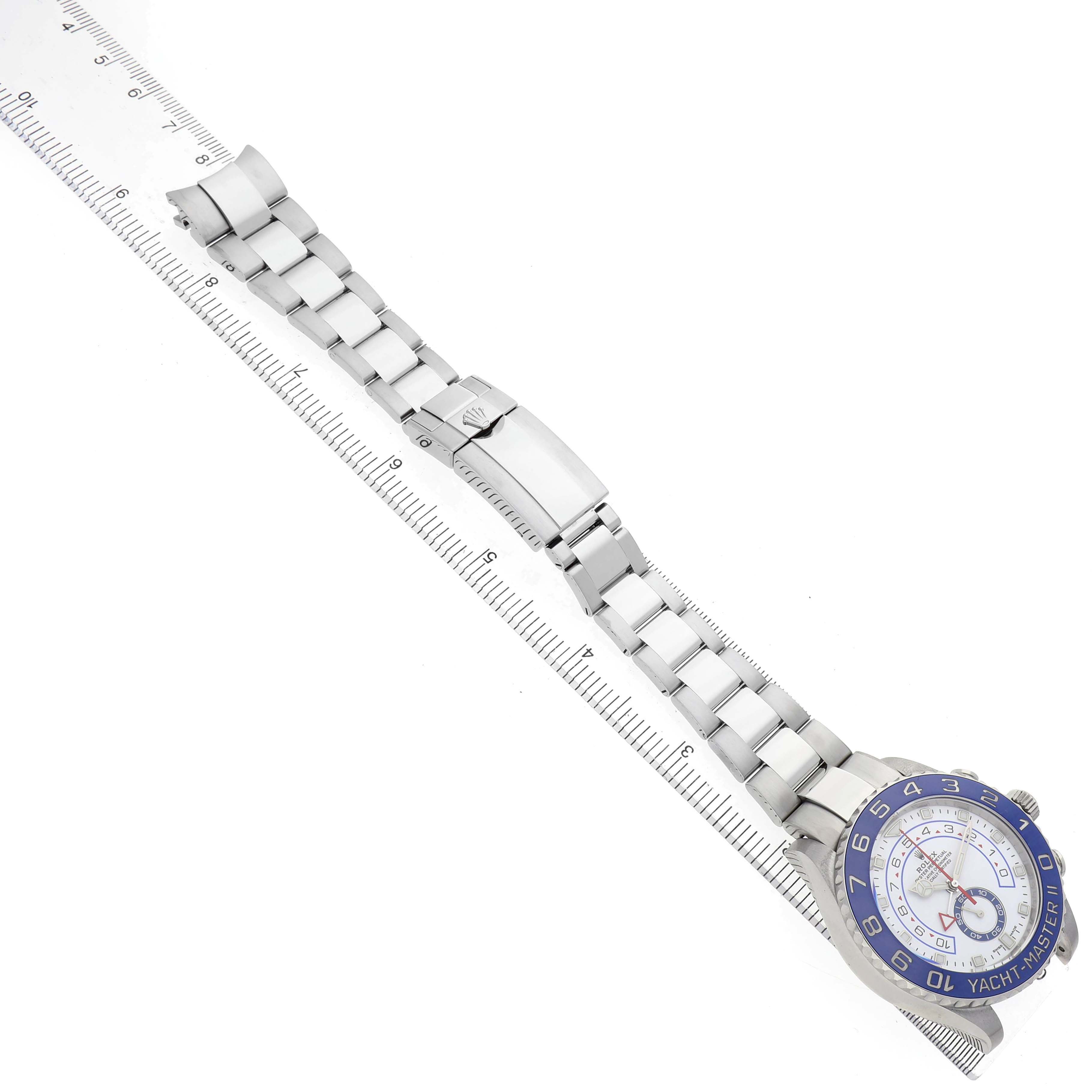 The image shows a Rolex Yacht-Master 116680 Men's Stainless Steel White Dial watch at a top-down angle, displaying the bracelet and the face partially.
