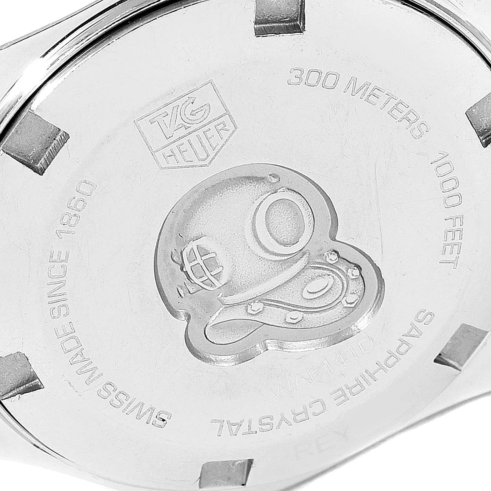 The image shows the back case of a Tag Heuer Aquaracer WAF141D Women's Stainless Steel Black Dial WAF141D Women's Stainless Steel Black Dial watch, displaying the brand logo and specifications.