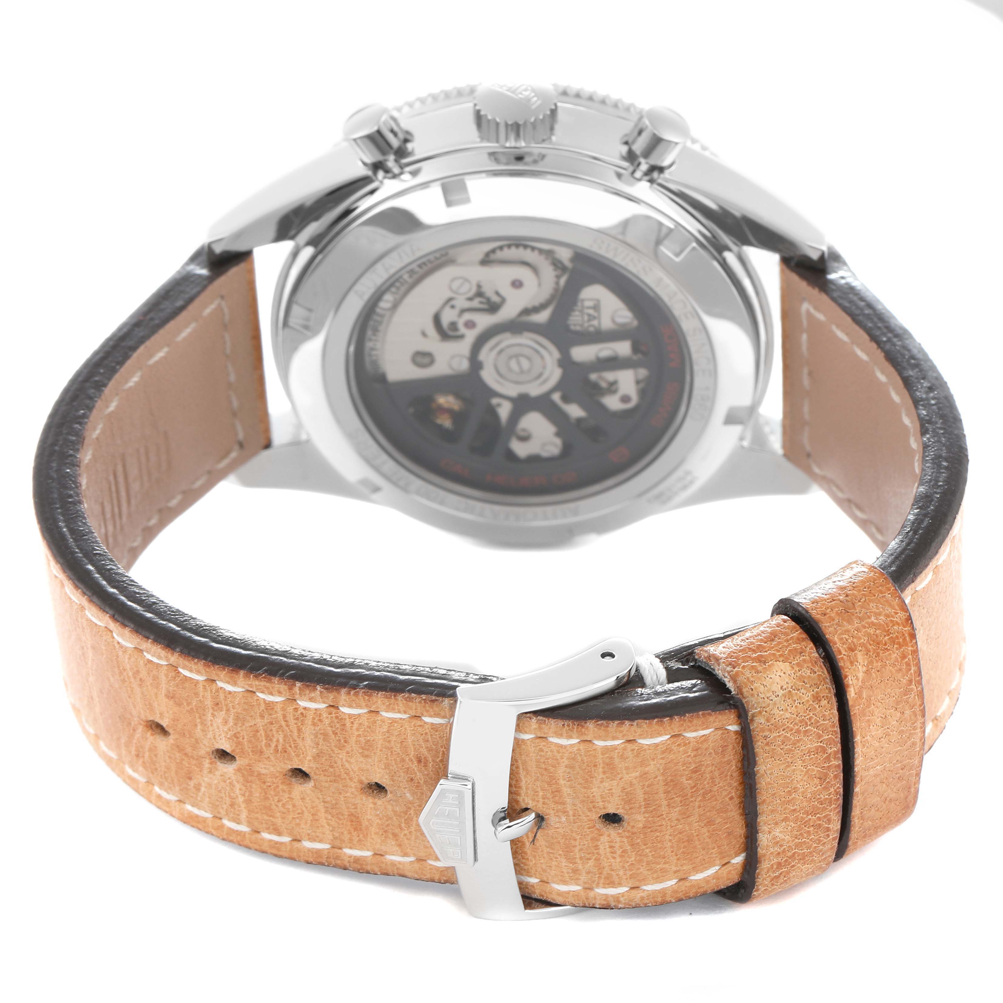 The image shows the back angle of the Tag Heuer Autavia CBE2110 Men
s Stainless Steel Black Dial watch, highlighting the transparent case back and leather strap.