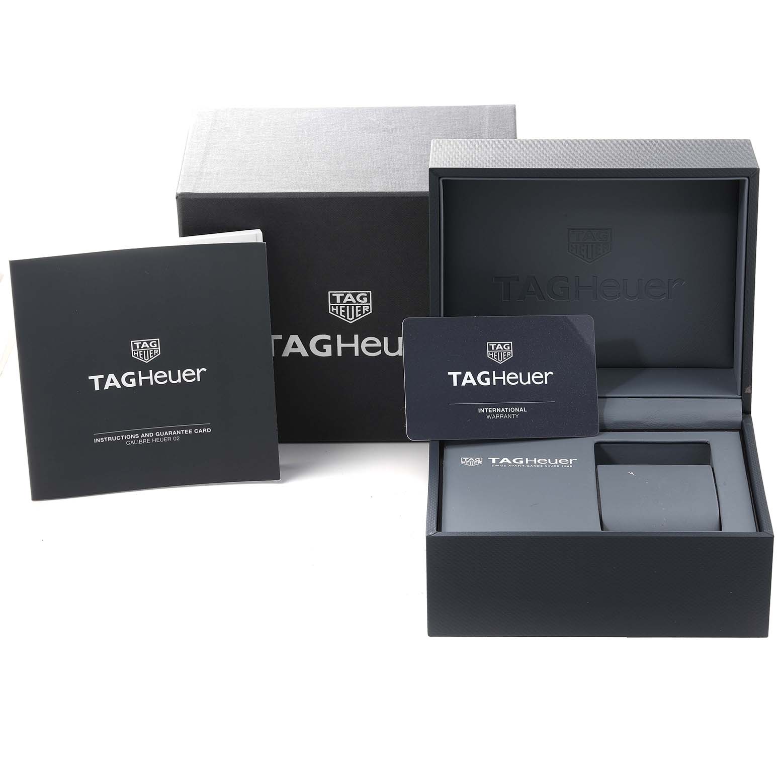 The image shows the packaging, instruction manual, warranty card, and presentation box for the Tag Heuer Carrera CBG2010 Men's Stainless Steel Black Dial CBG2010 Men's Stainless Steel Black Dial watch.