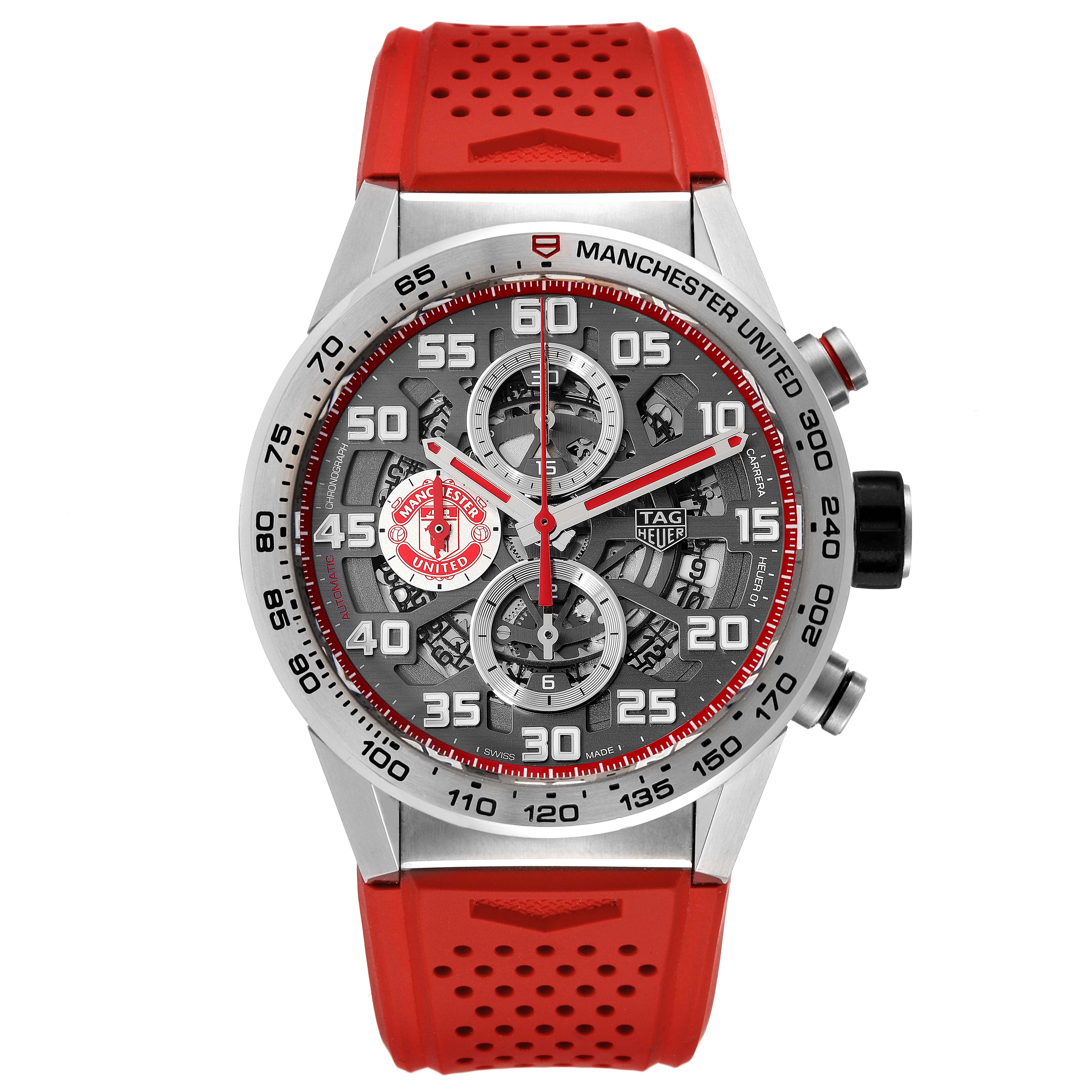 This image shows a front view of the Tag Heuer Carrera CAR201M.FT6156 Men's Stainless Steel Silver Dial CAR201M.FT6156 Men's Stainless Steel Silver Dial watch with a red strap and Manchester United branding.