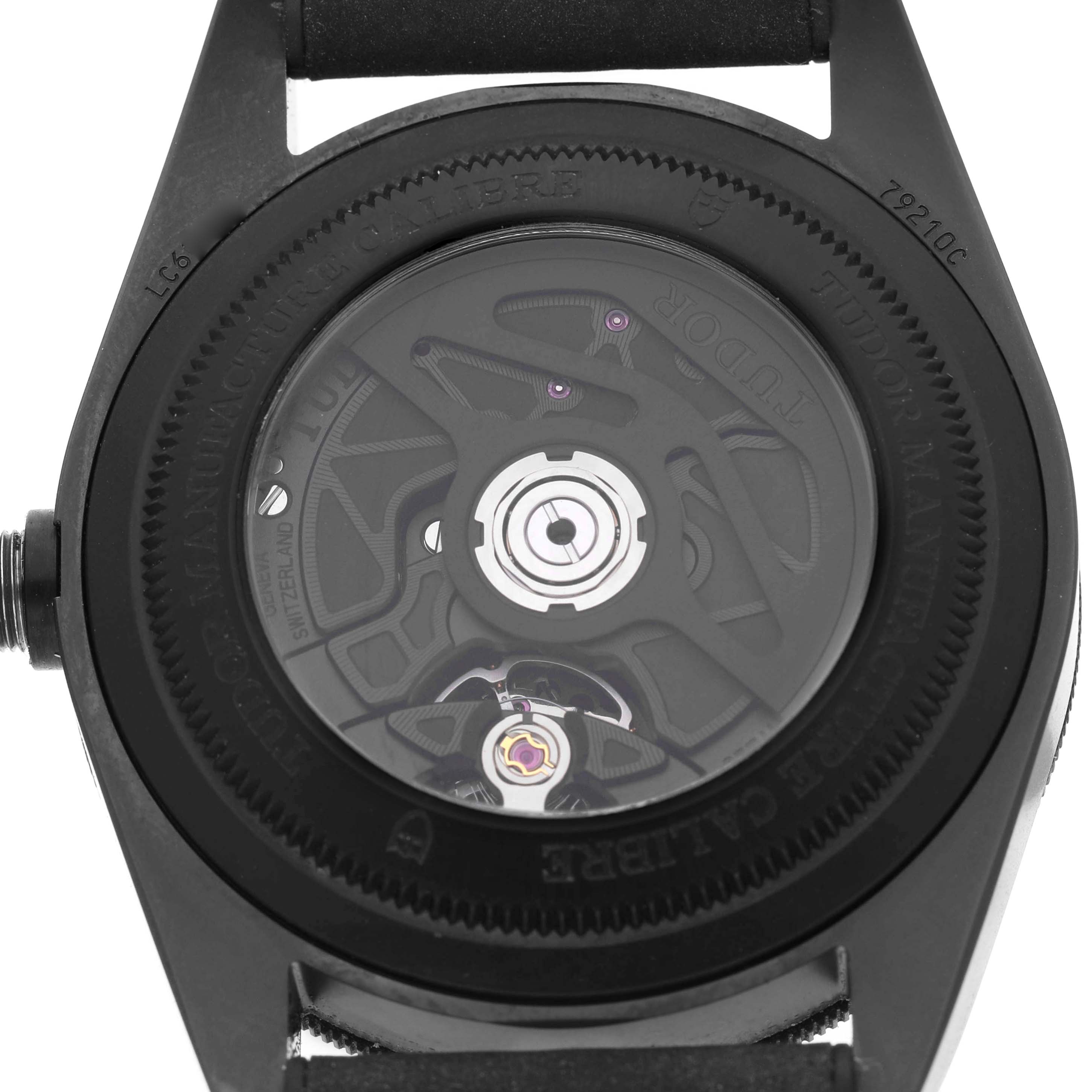 The image shows the backside of a Tudor Heritage Black Bay M79210CNU Men's Ceramic Black Dial watch, revealing its movement.