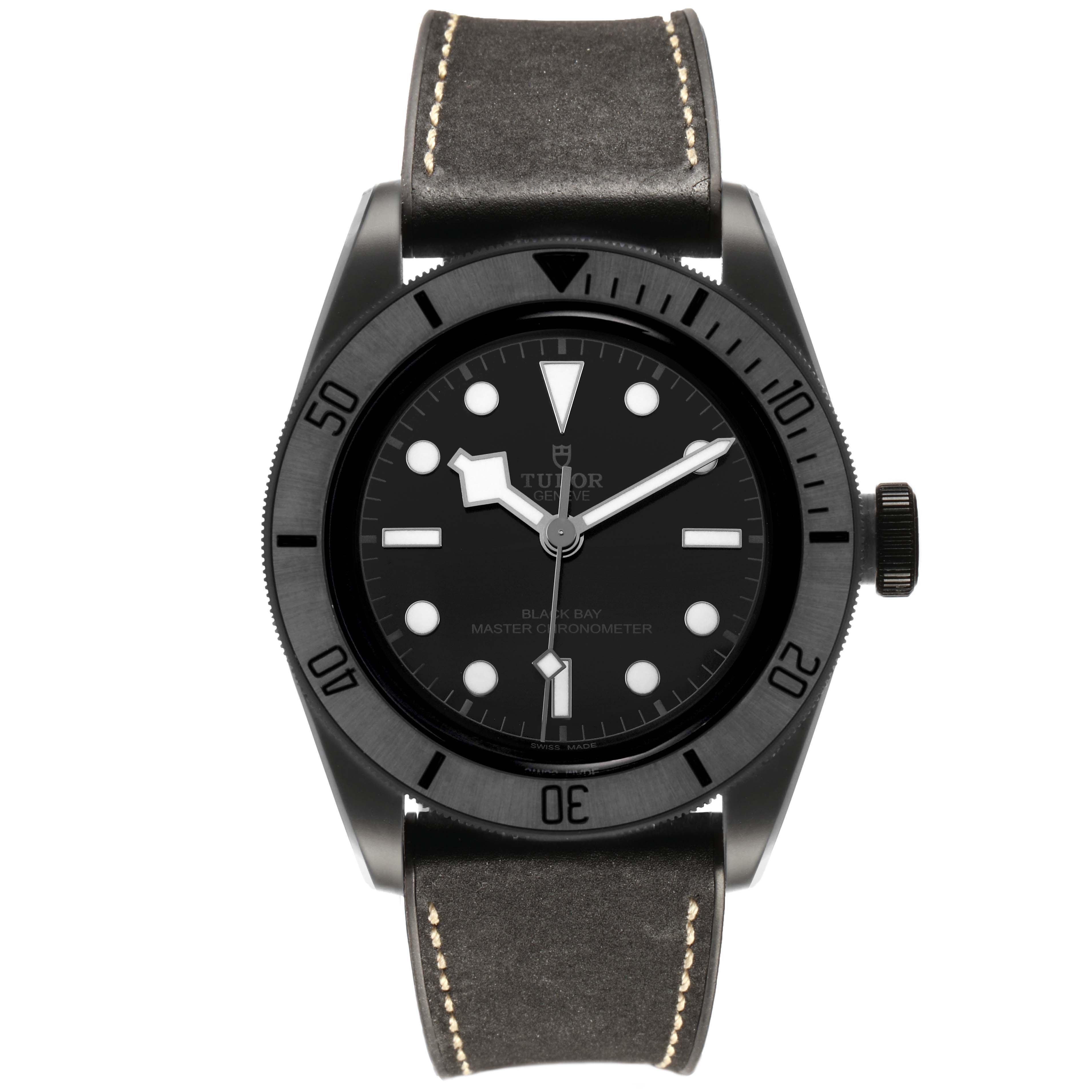 The Tudor Heritage Black Bay M79210CNU Men's Ceramic Black Dial watch is shown from the front, highlighting the dial, bezel, and leather strap.