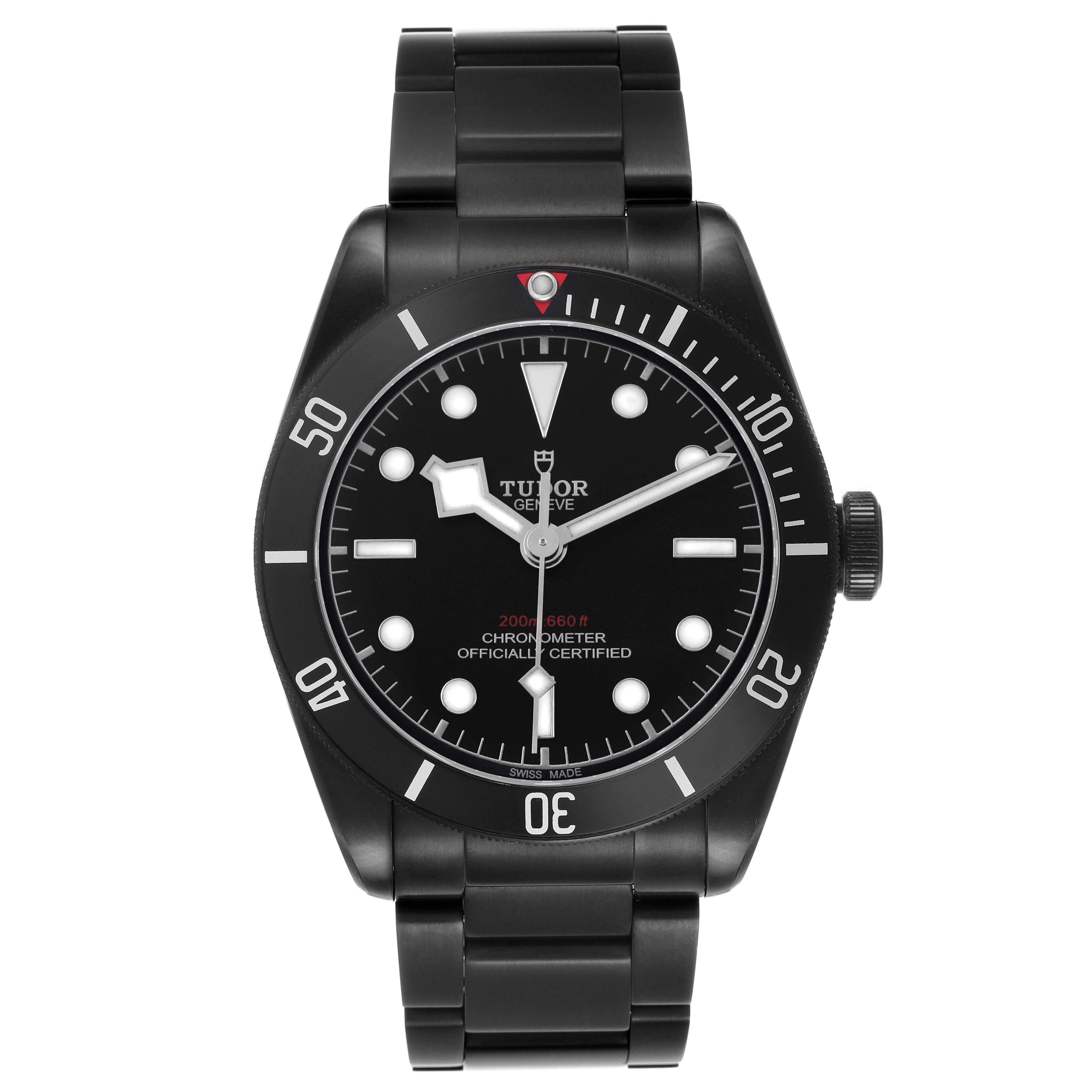 The image shows a front view of the Tudor Heritage Black Bay 79230DK Men's Stainless Steel Black Dial watch, displaying the dial, bezel, and bracelet.