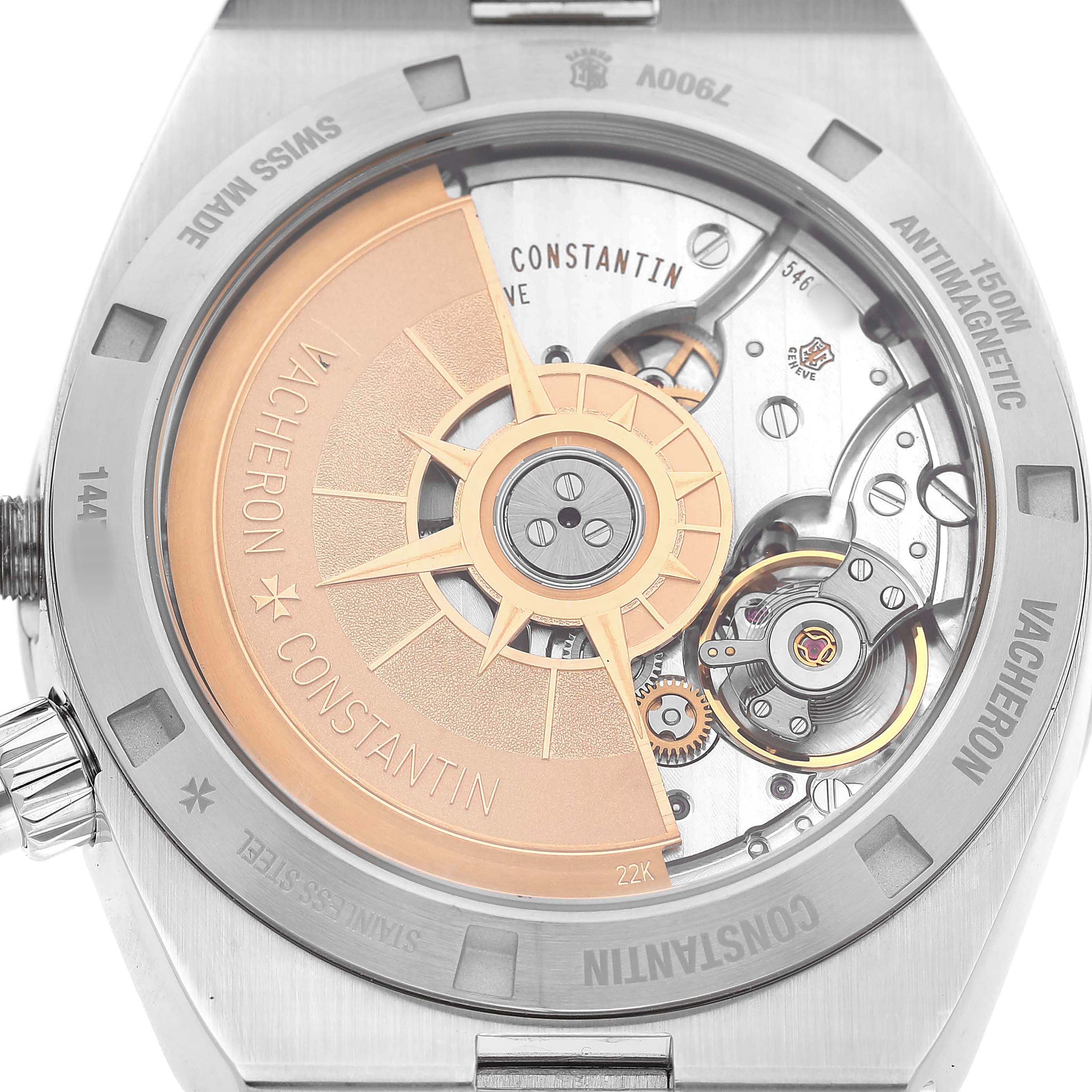 The image shows the back of a Vacheron Constantin Overseas 7900V/110A-B334 Men's Stainless Steel Blue Dial watch, highlighting its movement and rotor.