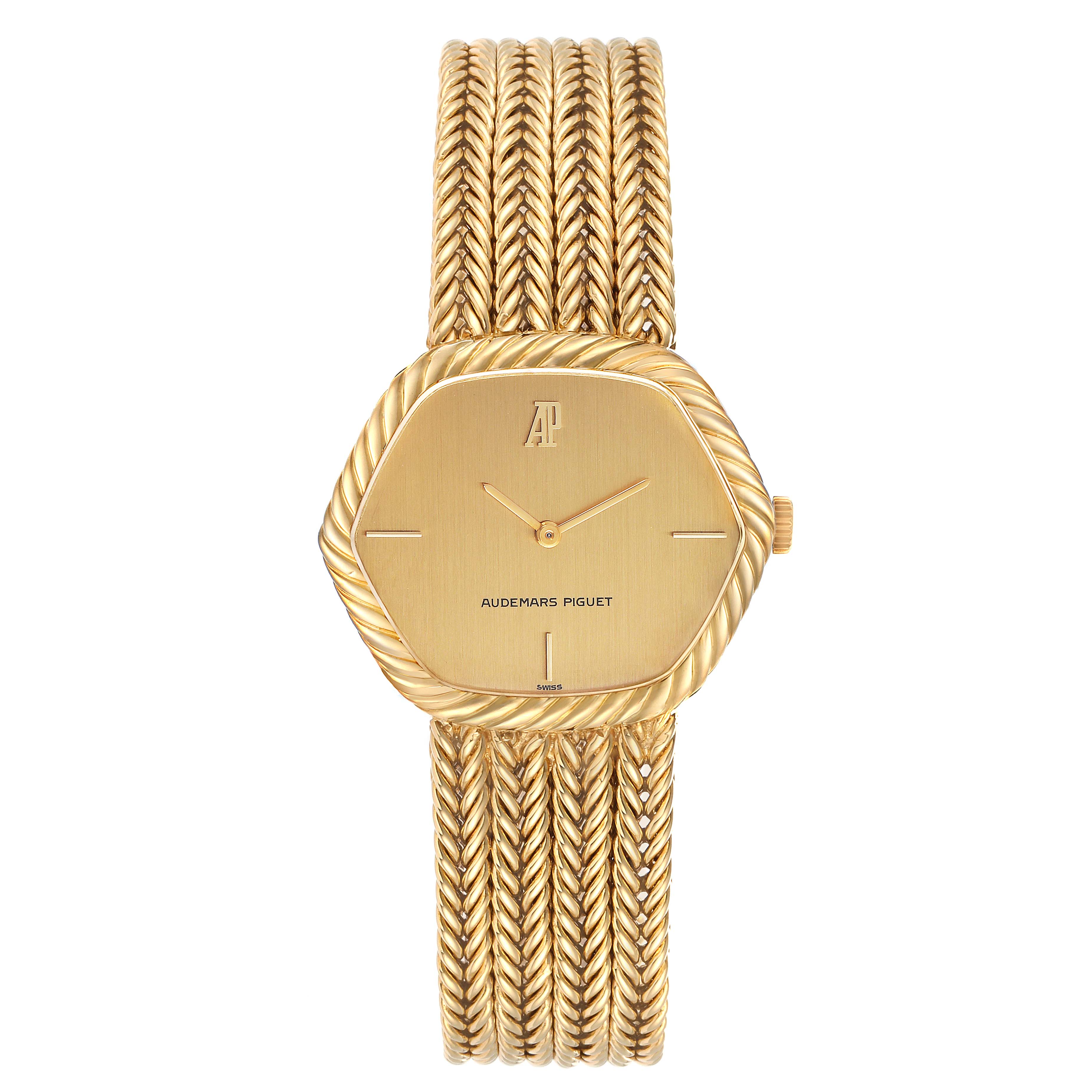 The Audemars Piguet Vintage Men
s Yellow Gold Champagne Dial watch is shown from the front, featuring its gold dial, bezel, and braided bracelet.