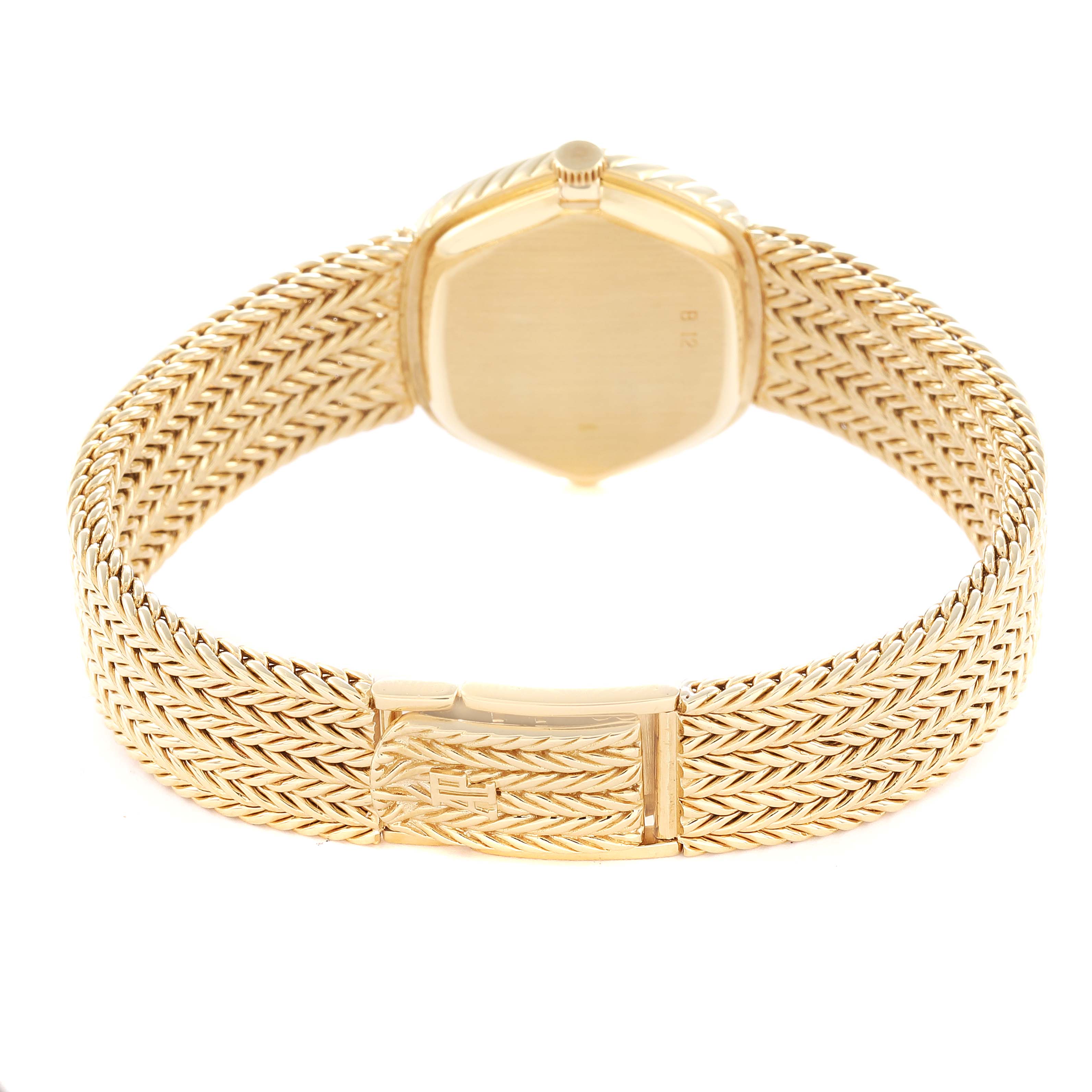 The Audemars Piguet Vintage Men
s Yellow Gold Champagne Dial watch is shown from the back, highlighting its woven bracelet and clasp.