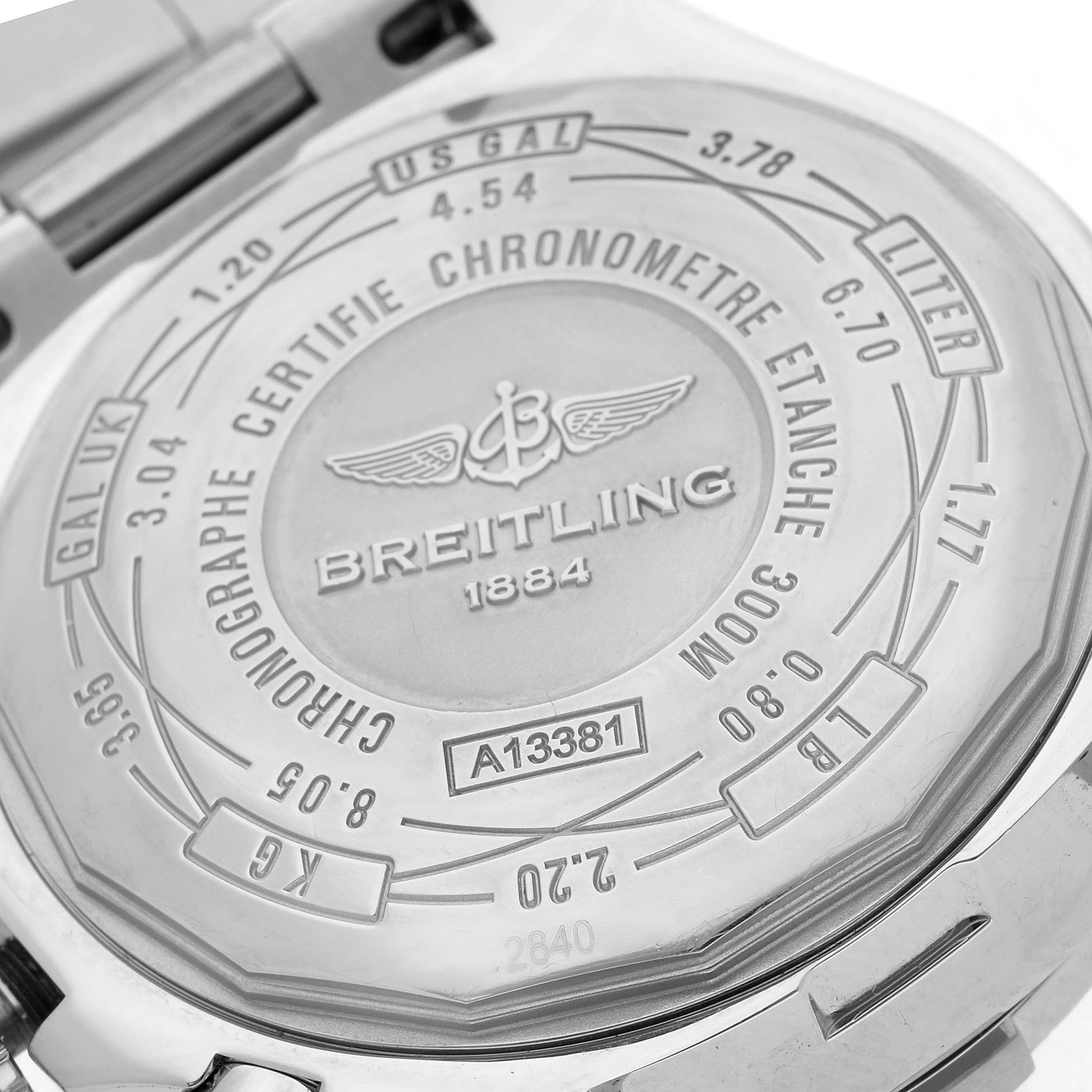 The image shows the case back of a Breitling Avenger A13381 Men
s Stainless Steel Blue Dial watch, featuring engraved details and branding.