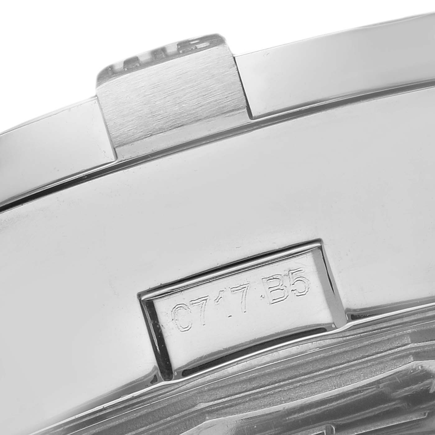 The image shows a close-up of the back or side of the Breitling Avenger A13381 Men
s Stainless Steel Blue Dial watch, highlighting part of the casing and engraved details.